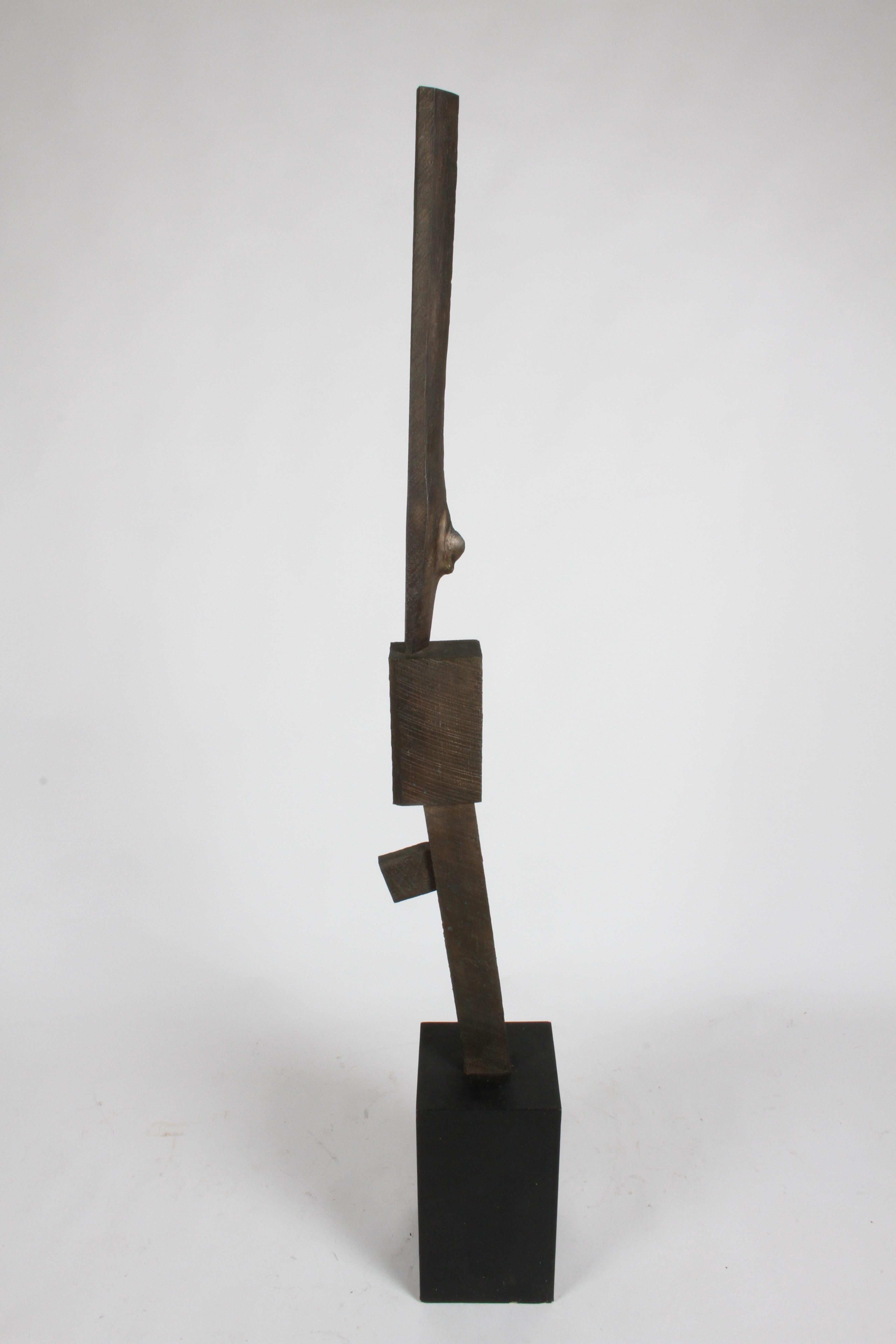 Stunning Mid-Century Modern Brutalist TOTEM bronze sculpture in the style of artist Joel Shapiro. Cast in bronze, the sculpture takes on the surface or texture of the wood grain and knots from the lumber that was used to make it. Applied patina to