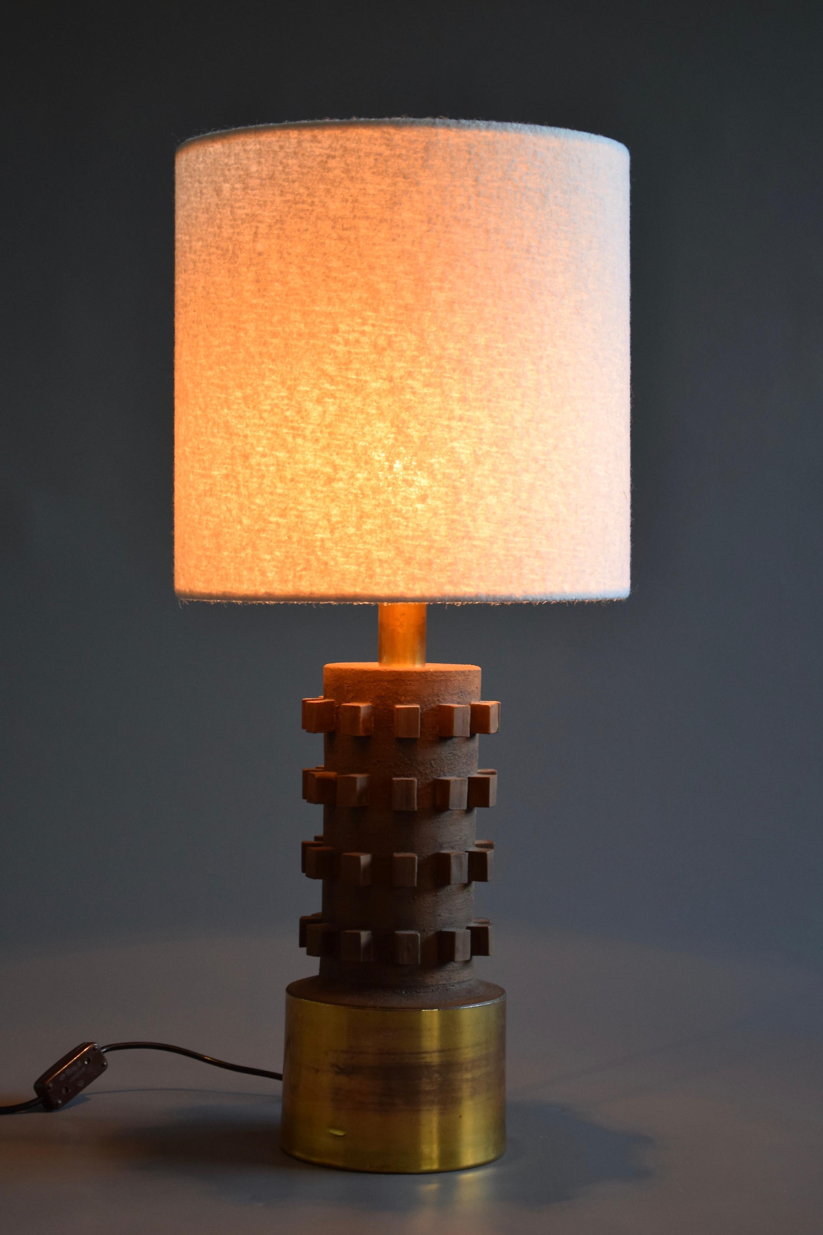 Beautiful one of a kind brown ceramic and gold plated ceramic Mid-Century Modern table lamp. The bouclé shade was recently custom made. 
The lamp is in perfect condition.
It will be shipped insured overseas in a custom made wooden crate. Cost of