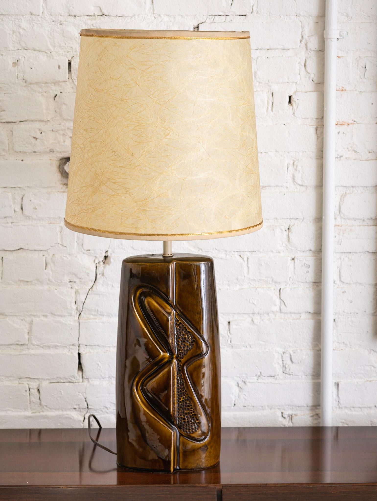 A mid century modern ceramic lamp with abstract 
