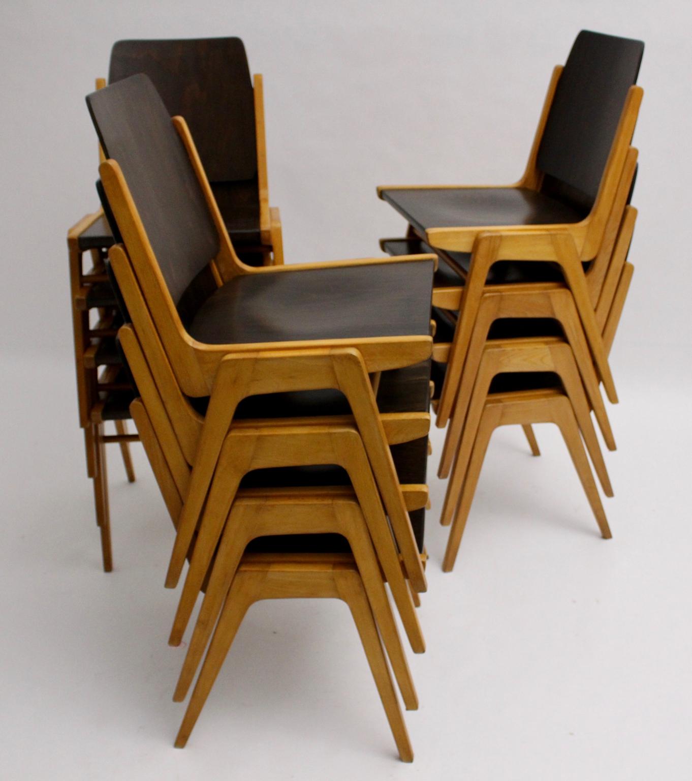 Mid Century Modern set of 12 stackable bicolored dining room chairs designed by Franz Schuster (1892-1972) for the Forum Stadtpark Graz 1959, model Austro Chairs, and executed by Wiesner - Hager, Austria.
Franz Schuster was a famed Austrian