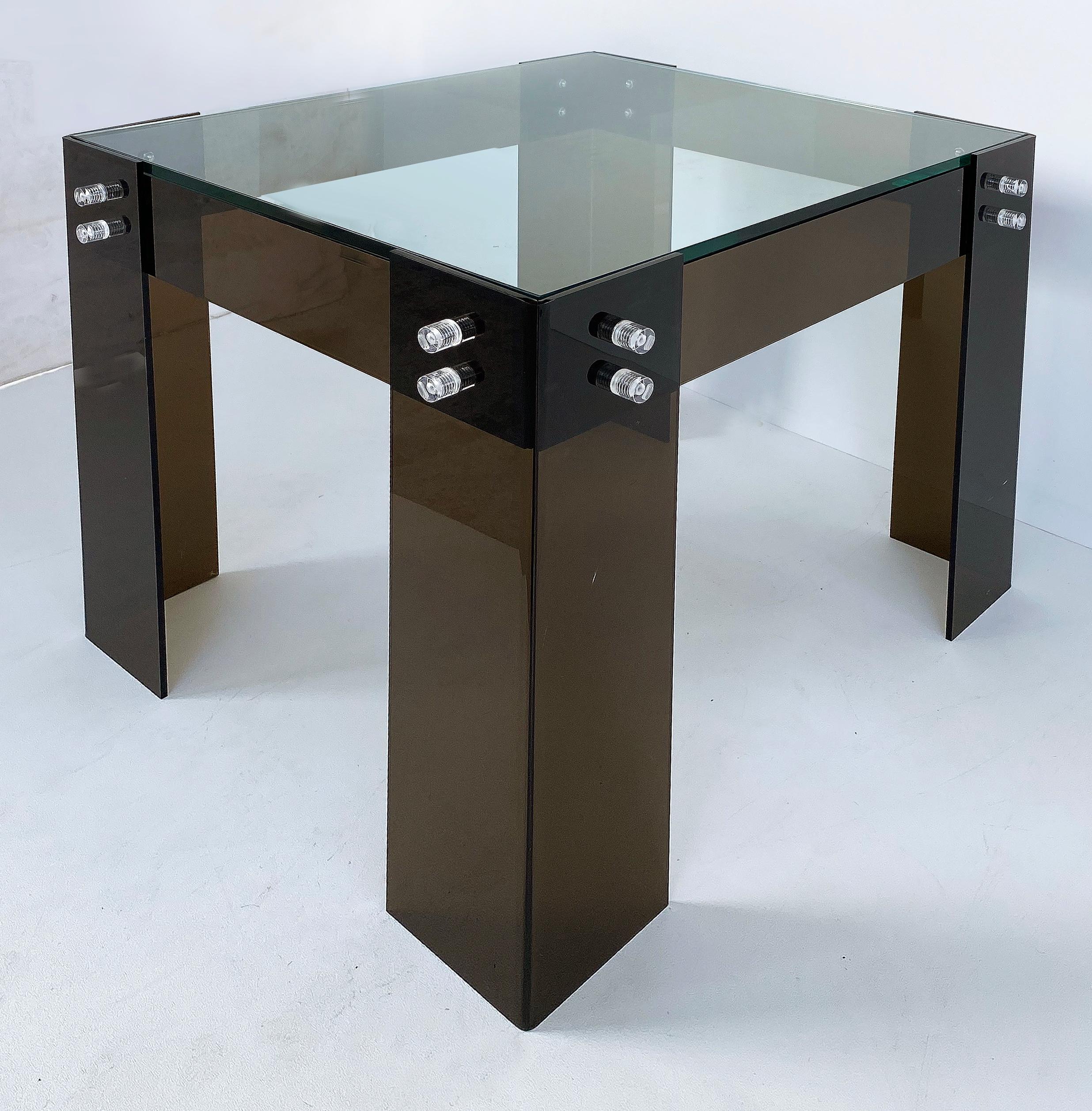 Mid-Century Modern brown lucite side table with inset glass top

Offered for sale is a stylish smoked -brown lucite Mid-Century Modern side table with an inset glass top. The table is secured by clear lucite screws on all sides.