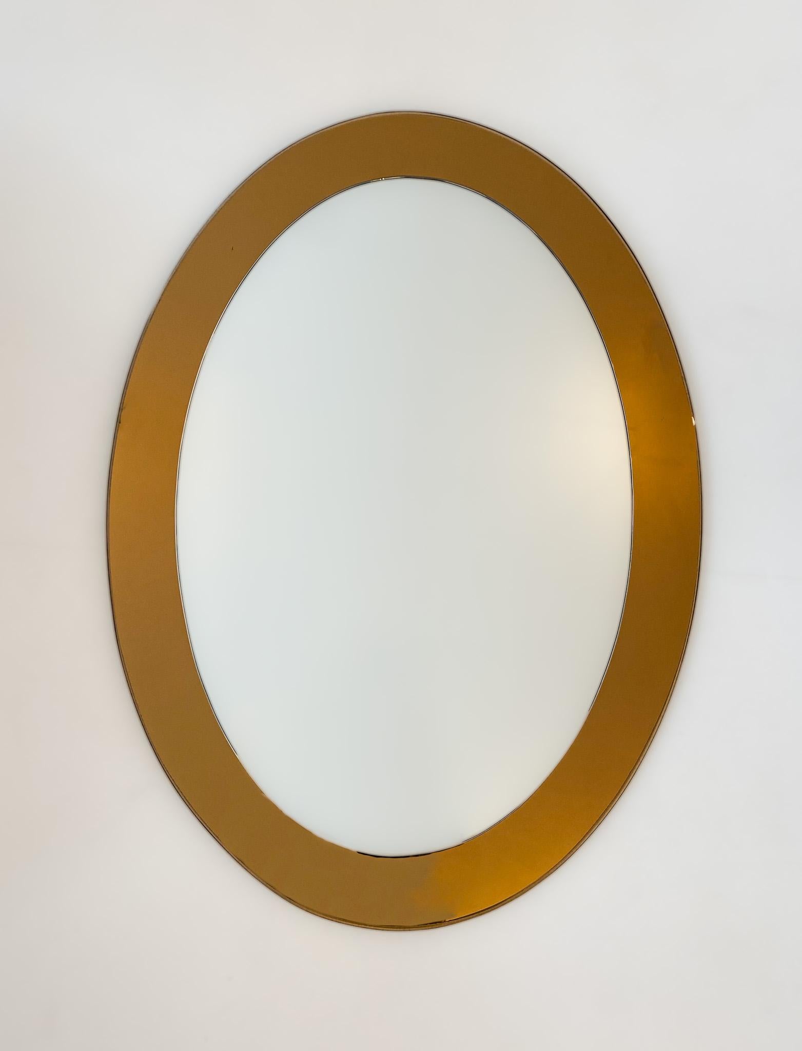 Mid-Century Modern brown oval glass wall mirror, Italy 1970s.

Very elegant oval shaped Italian wall mirror from the 70s. This wall mirror convinces with its frame of brown mirrored crystal glass and its oval shape. The glass of the mirror is very