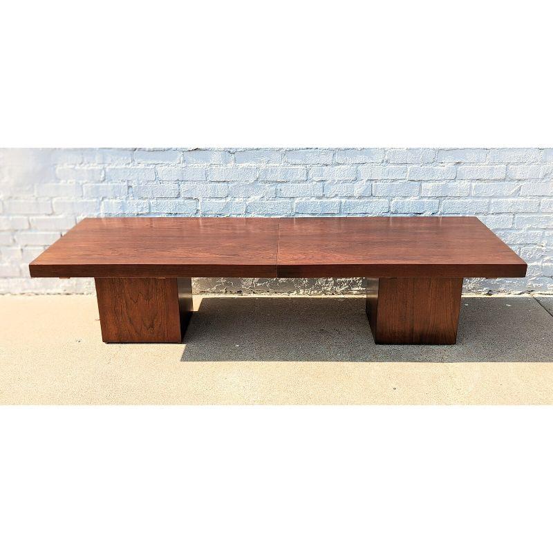Mid Century Modern Brown Saltman Extendable Coffee Table by John Keal
 
Above average vintage condition and structurally sound. Very little scratching or finish wear. Outdoor listing pictures might appear slightly darker or more red than the item