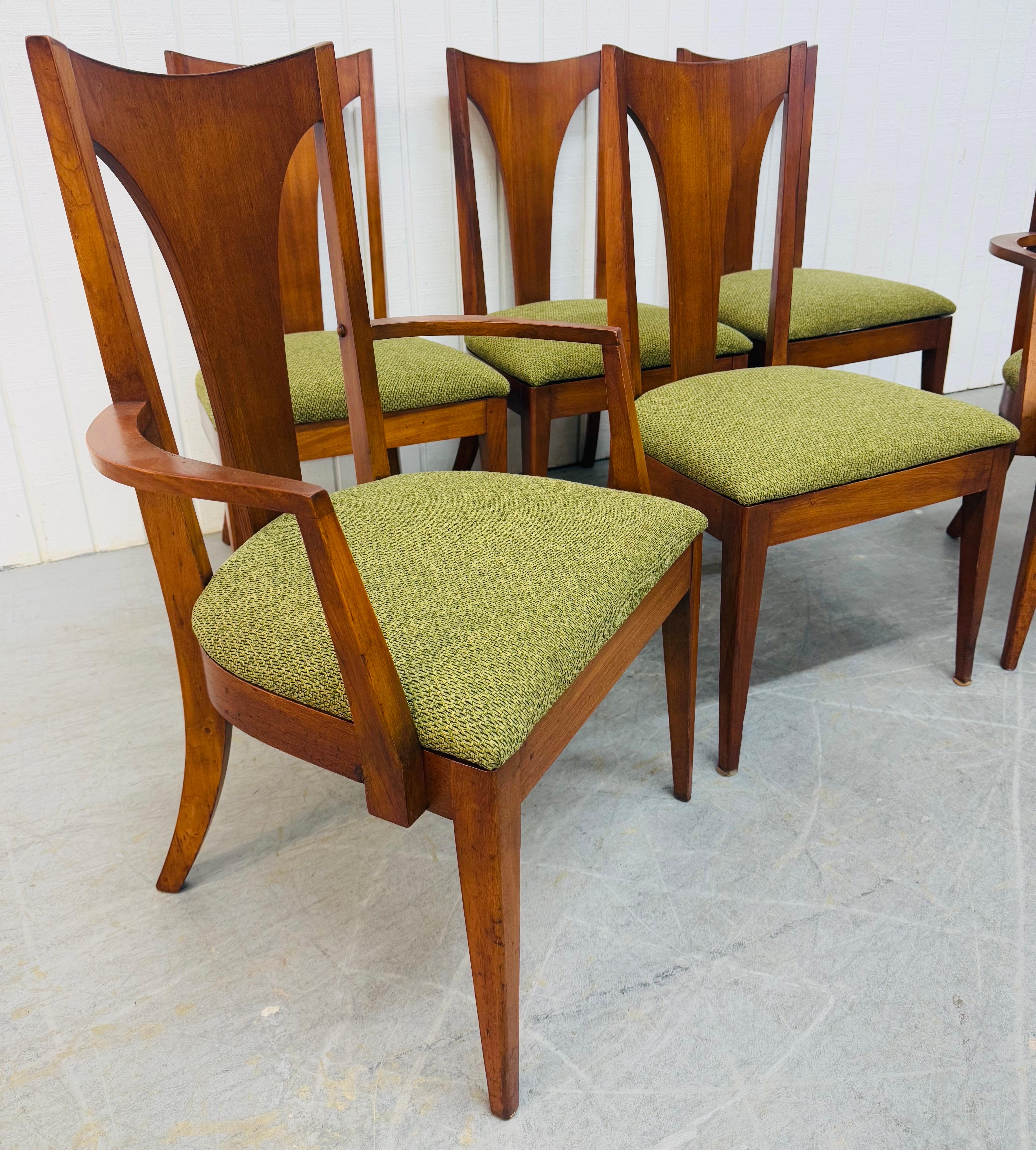 This listing is for a set of six Mid-Century Modern Broyhill Brasilia Walnut Dining Chairs. Featuring a curved “T” back design, two arm chairs, four side chairs, modern legs, new green upholstery, and a beautiful walnut finish. This is an