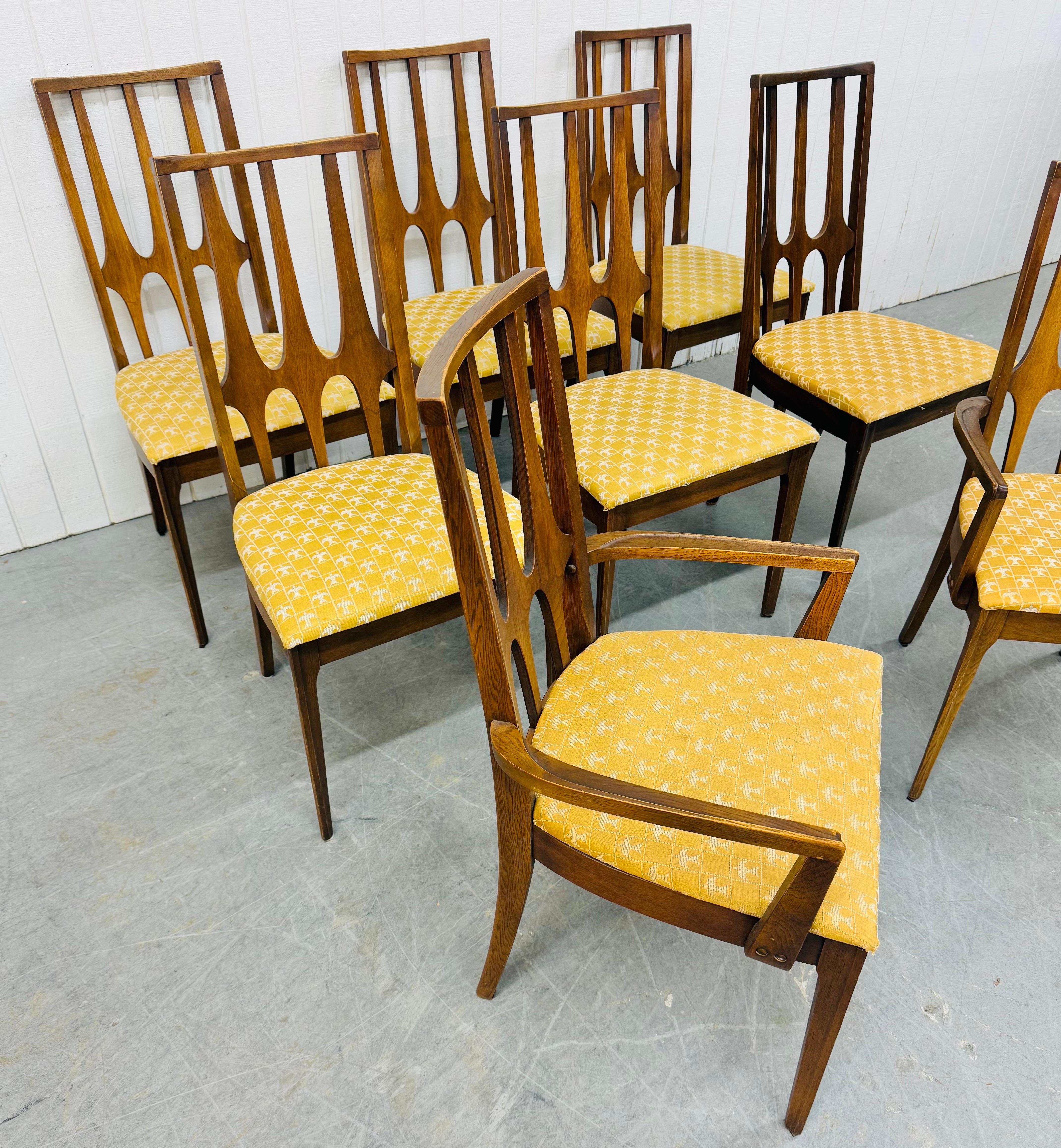 This listing is for a set of Mid-Century Modern Broyhill Brasilia Walnut Dining Chairs. Featuring a high back sculpted design, two arm chairs, six side chairs, original upholstery, and a beautiful walnut finish. This is an exceptional combination of