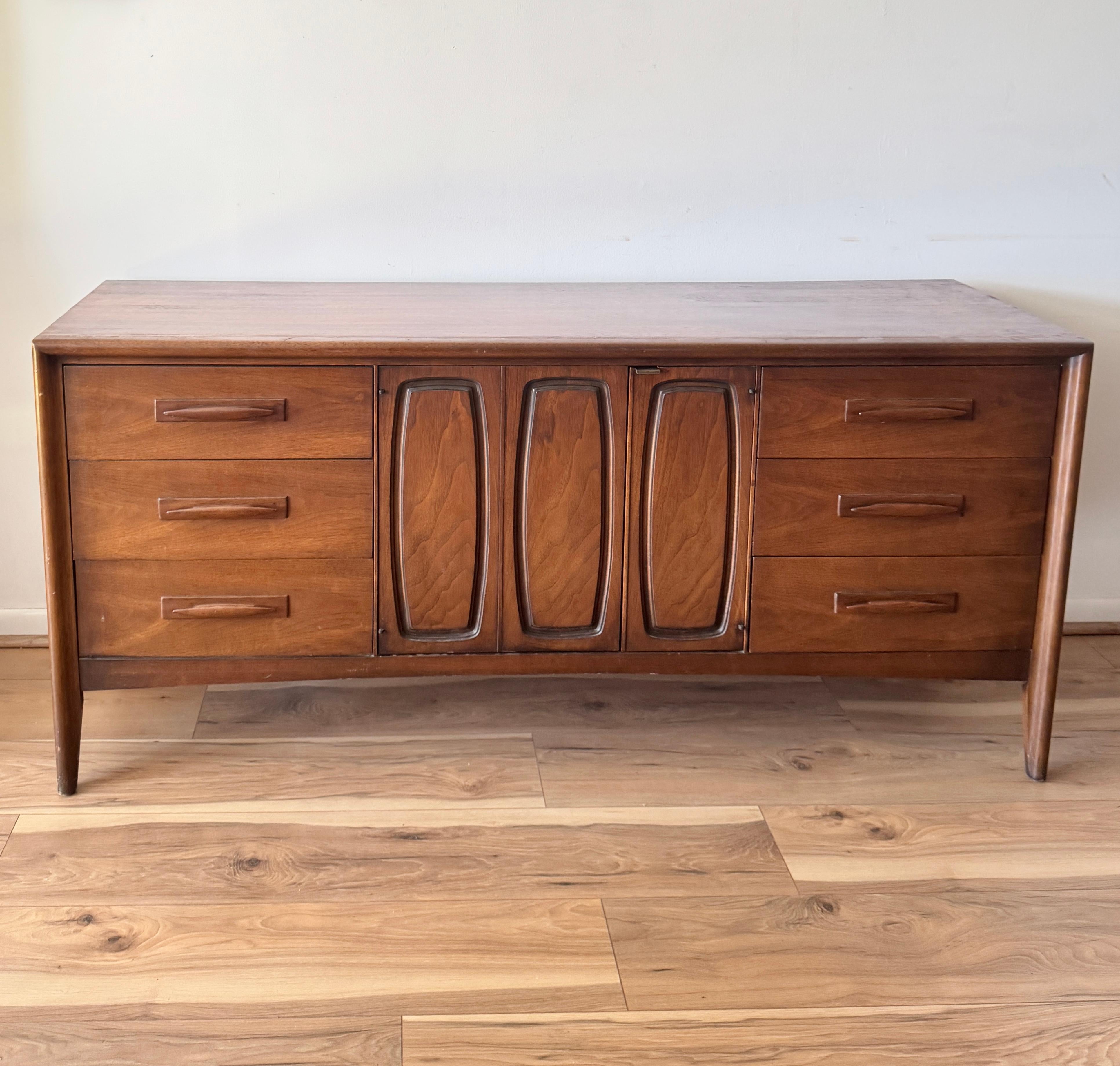 Beautiful Broyhill Emphasis sculpted walnut credenza or dresser. Clean mid-century lines.

