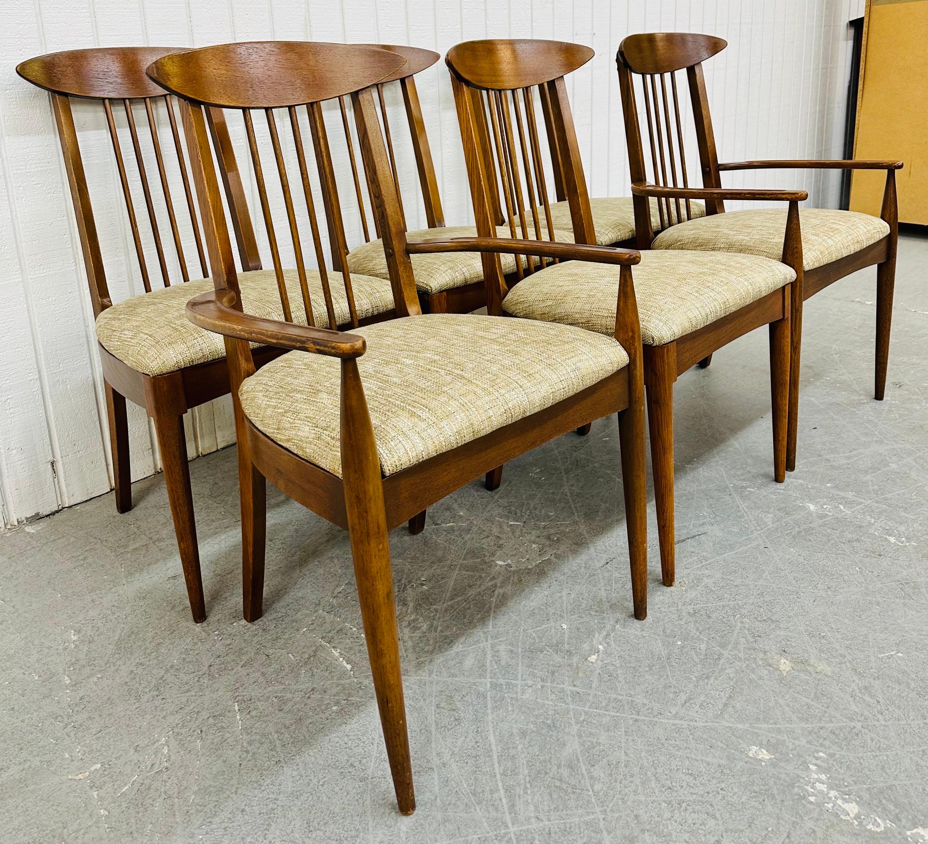 This listing is for a set of six Mid-Century Modern Broyhill Sculptra Walnut Dining Chairs. Featuring a comb back design, two arm chairs, four side chairs, newly upholstered seats, and a beautiful walnut finish. This is an exceptional combination of