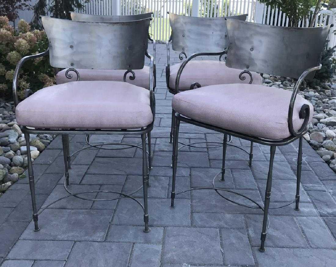 Mid-Century Modernist yet classically styled vintage wrought iron indoor or outdoor, porch or patio dining chairs. The bold styling works well with Classic or modern sleek contemporary interiors. Scroll form arms, modernist back splat. Great form,