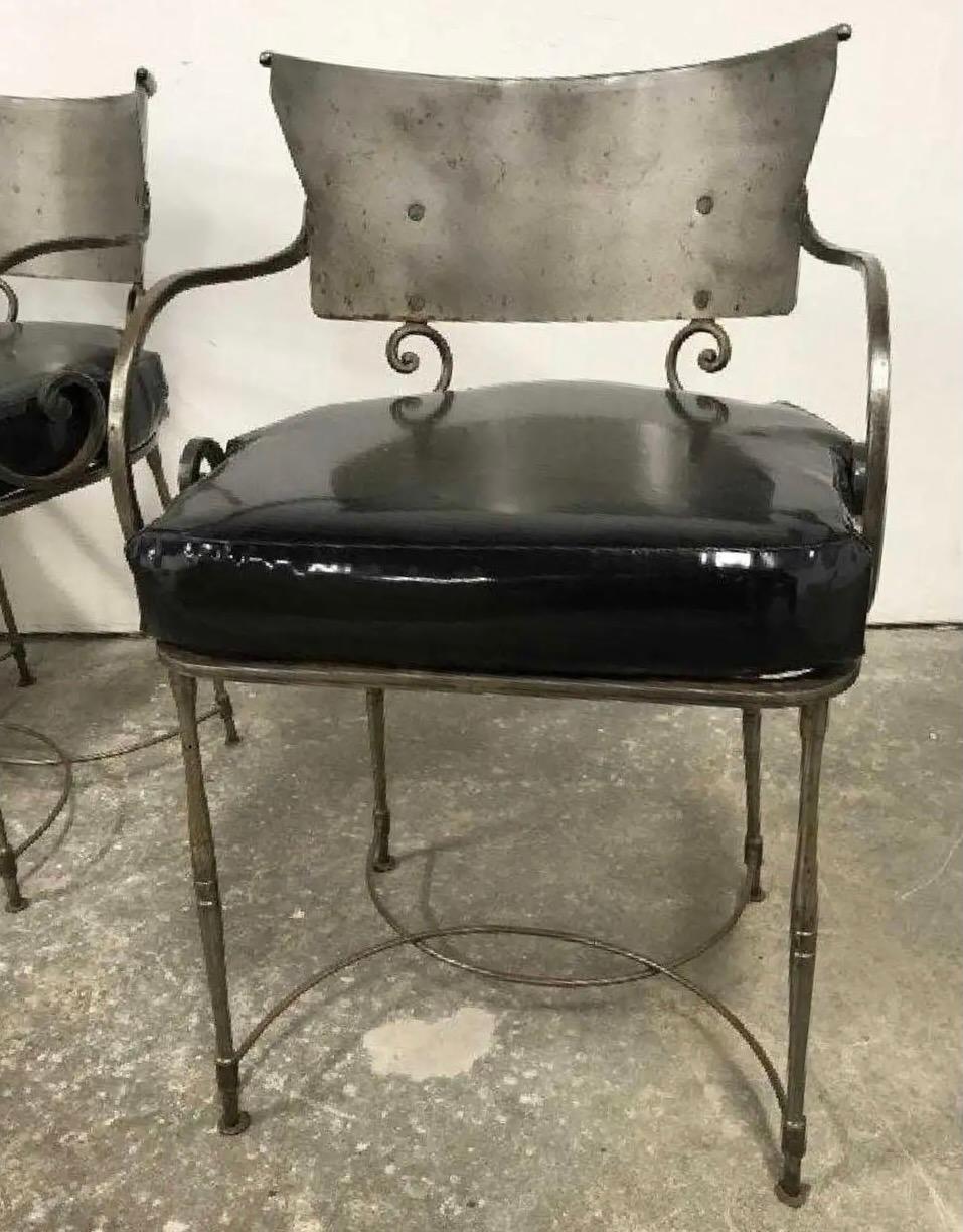 Mid-Century Modernist yet classically styled vintage wrought iron indoor or outdoor, porch or patio dining chairs. The bold styling works well with classic or modern sleek contemporary interiors. Scroll form arms, modernist back splat. Great form,