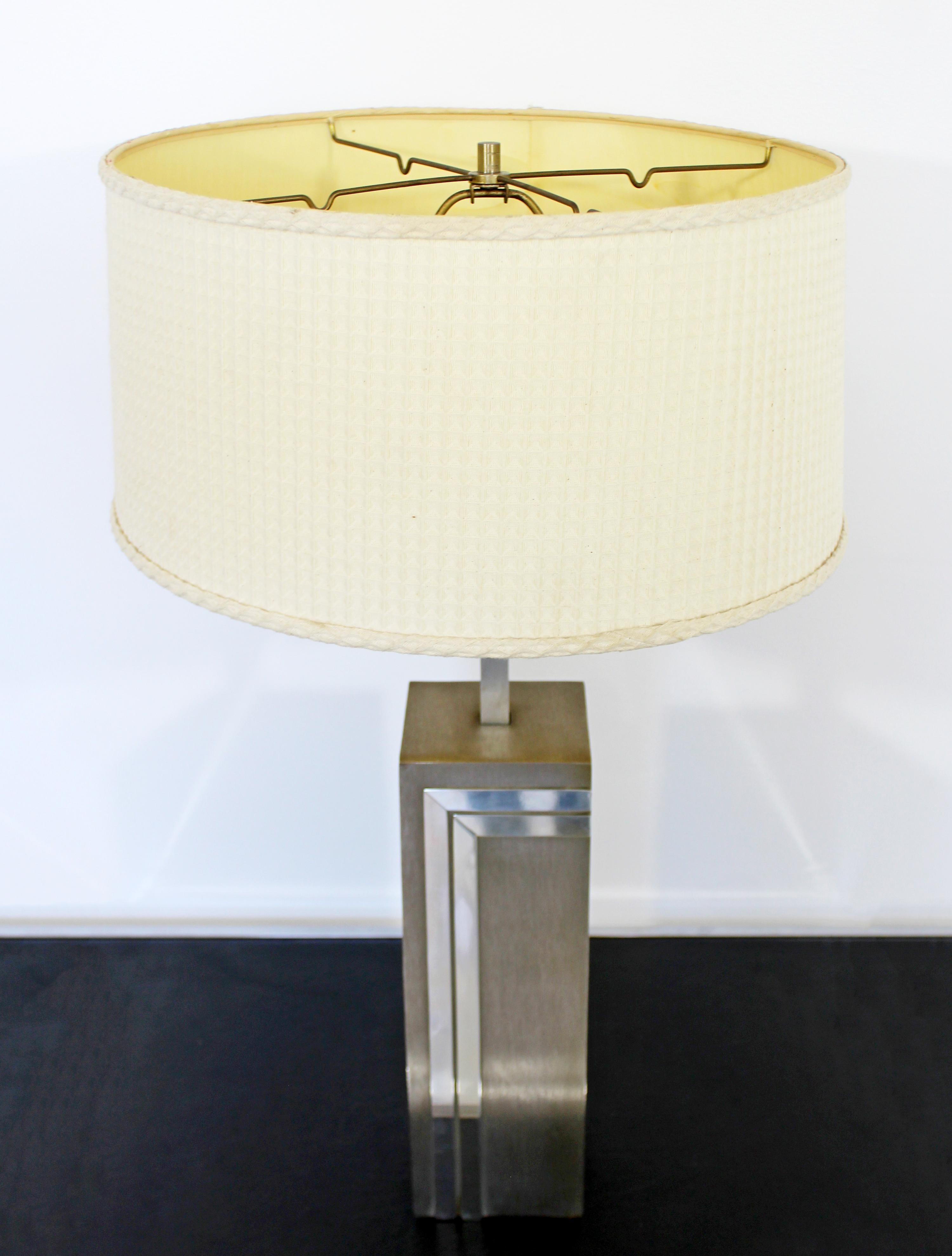 For your consideration is a beautiful, brushed aluminum table lamp, with original shade and finial, by Pierre Cardin, made in France, circa 1970s. In excellent vintage condition. The dimensions of the lamp are 5