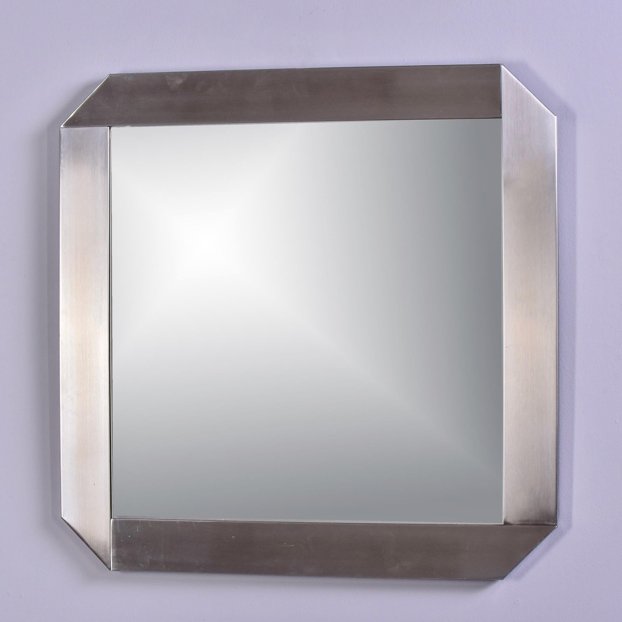 Found in France, this square mirror has a brushed steel frame and blunted corners. Unknown maker, no markings found. 

Very good vintage condition.