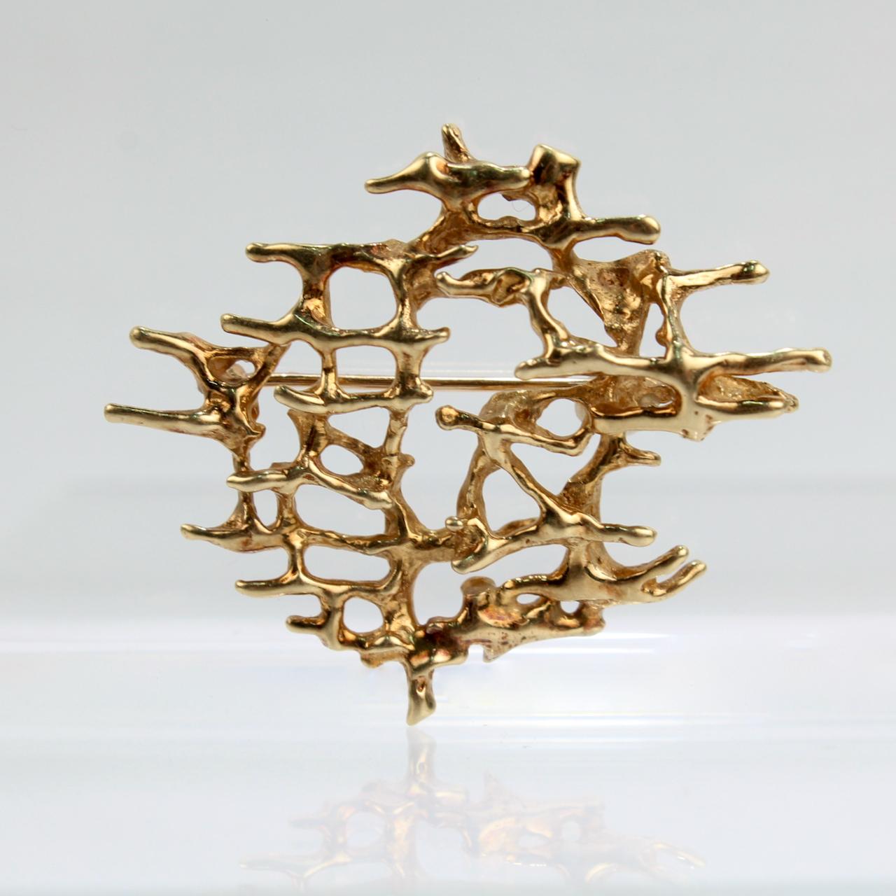 A fine brutalist brooch.

In 14k yellow gold.

With an organic, cast, root-like matrix pattern.

Great Brutalist design!

Date:
Mid-20th Century

Overall Condition:
It is in overall good, as-pictured, used estate condition with some very fine &