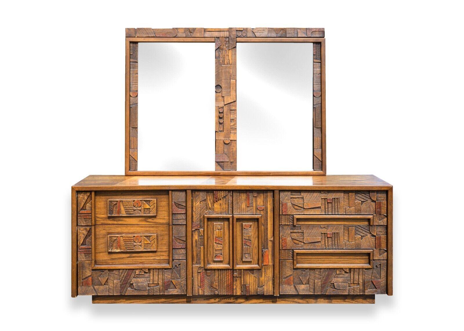 A brutalist 2pc bedroom set by Lane Pueblo Collection. This magnificent bedroom set from Lane furniture's Pueblo Collection. This multi-piece set includes a tall dresser cabinet, a long dresser credenza, and a large mirror that attaches to the long