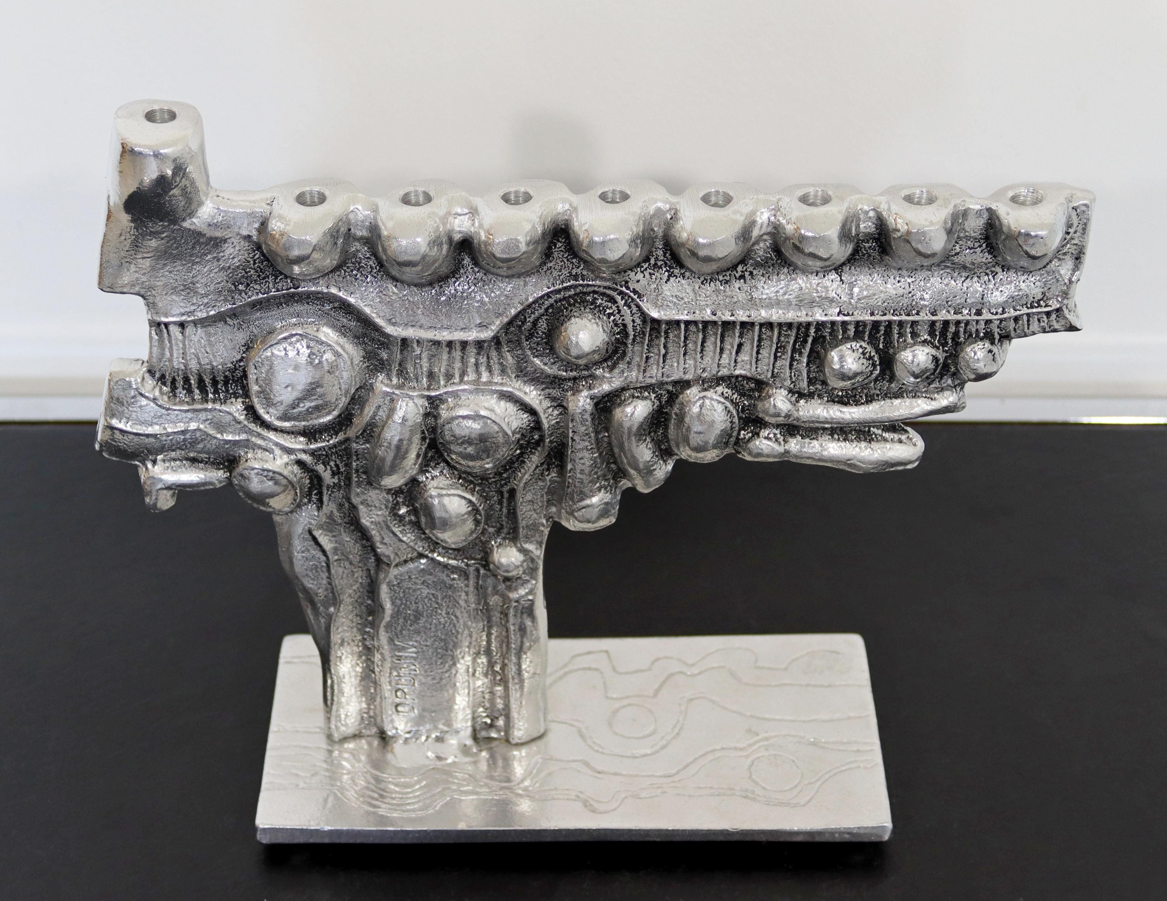 For your consideration is a beautiful, Brutalist menorah, made of aluminum, signed by Donald Drumm, circa the 1970s. In excellent vintage condition. The dimensions are 12