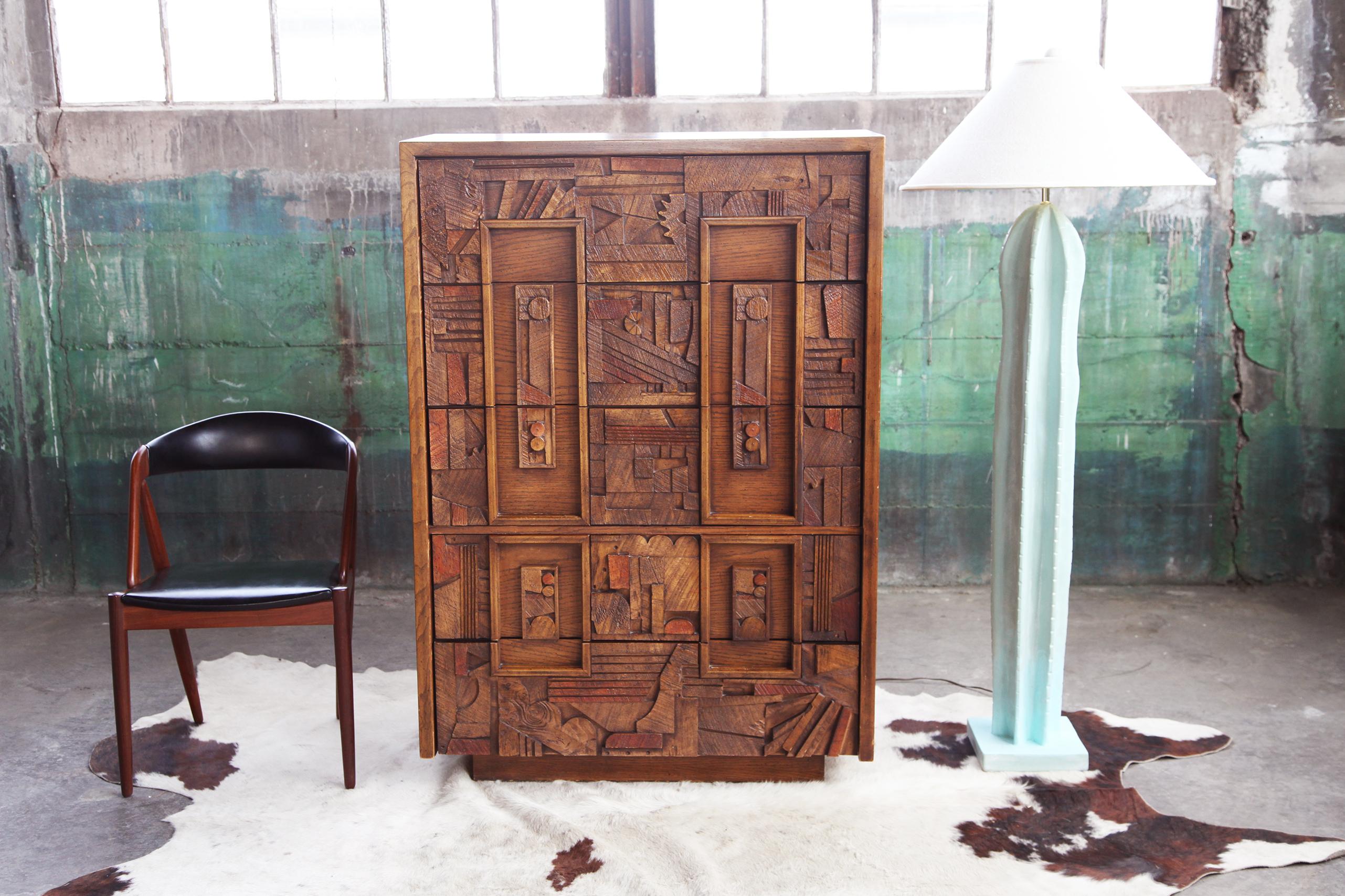 Absolutely awesome, unique and stunningly made Brutalist 5 drawer tall dresser or storage unit, with hand carved details unique to the 70s era. This piece is a hard one to find of the series. This can be used as a large dresser, bar, or storage
