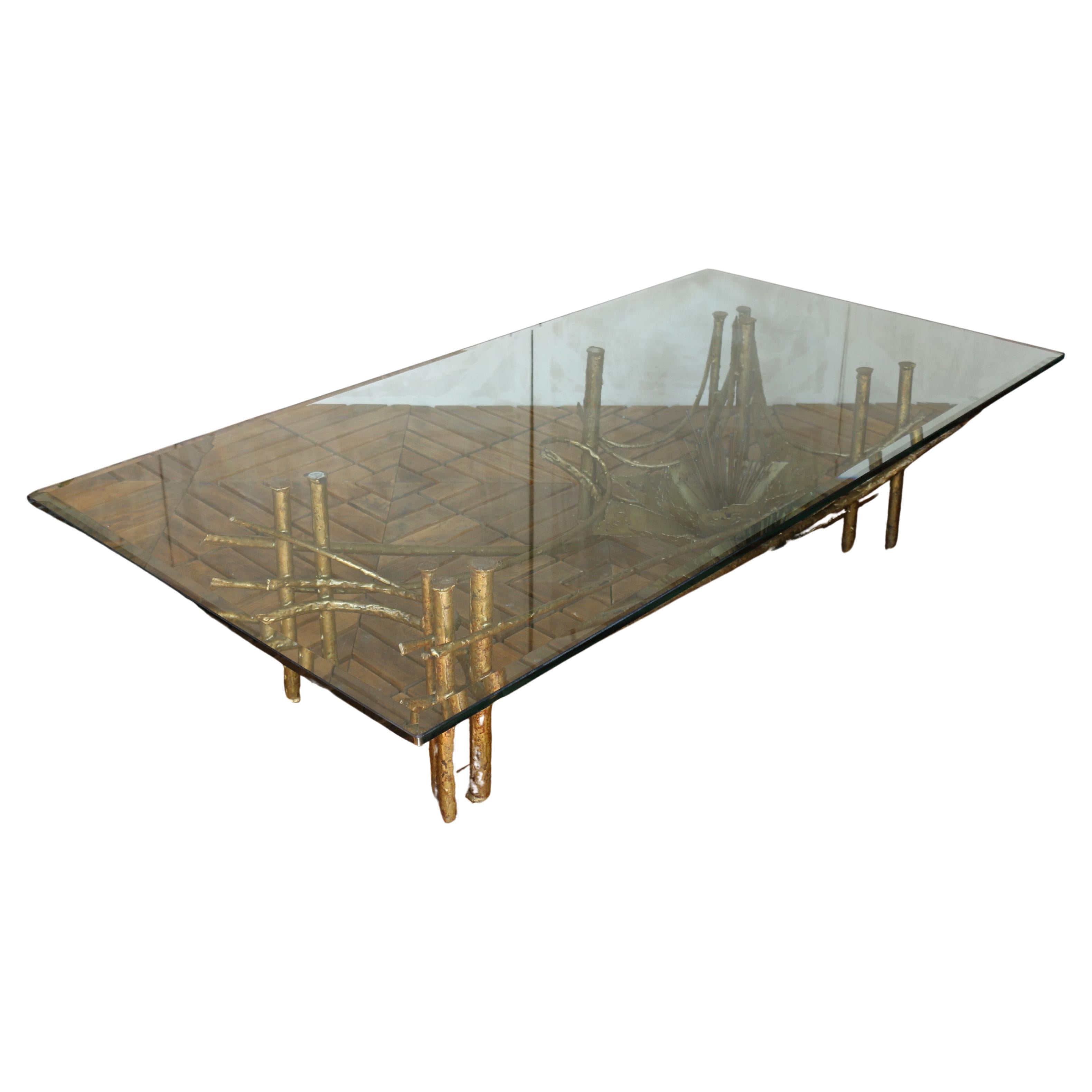 This extraordinary mid-century coffee table embodies the bold, artistic spirit of the Brutalist movement. Crafted in the 1960s and inspired by the iconic work of Silas Seandel, it features a sculptural lotus flower base formed from hand-welded and