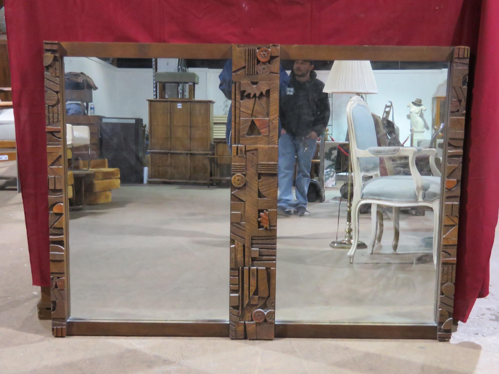 An intriguing vintage mirror featuring a Brutalist-style arrangement of sculpted geometric shapes in its frame, in the style of Lane Furniture. Please confirm item location with seller (NY/NJ).