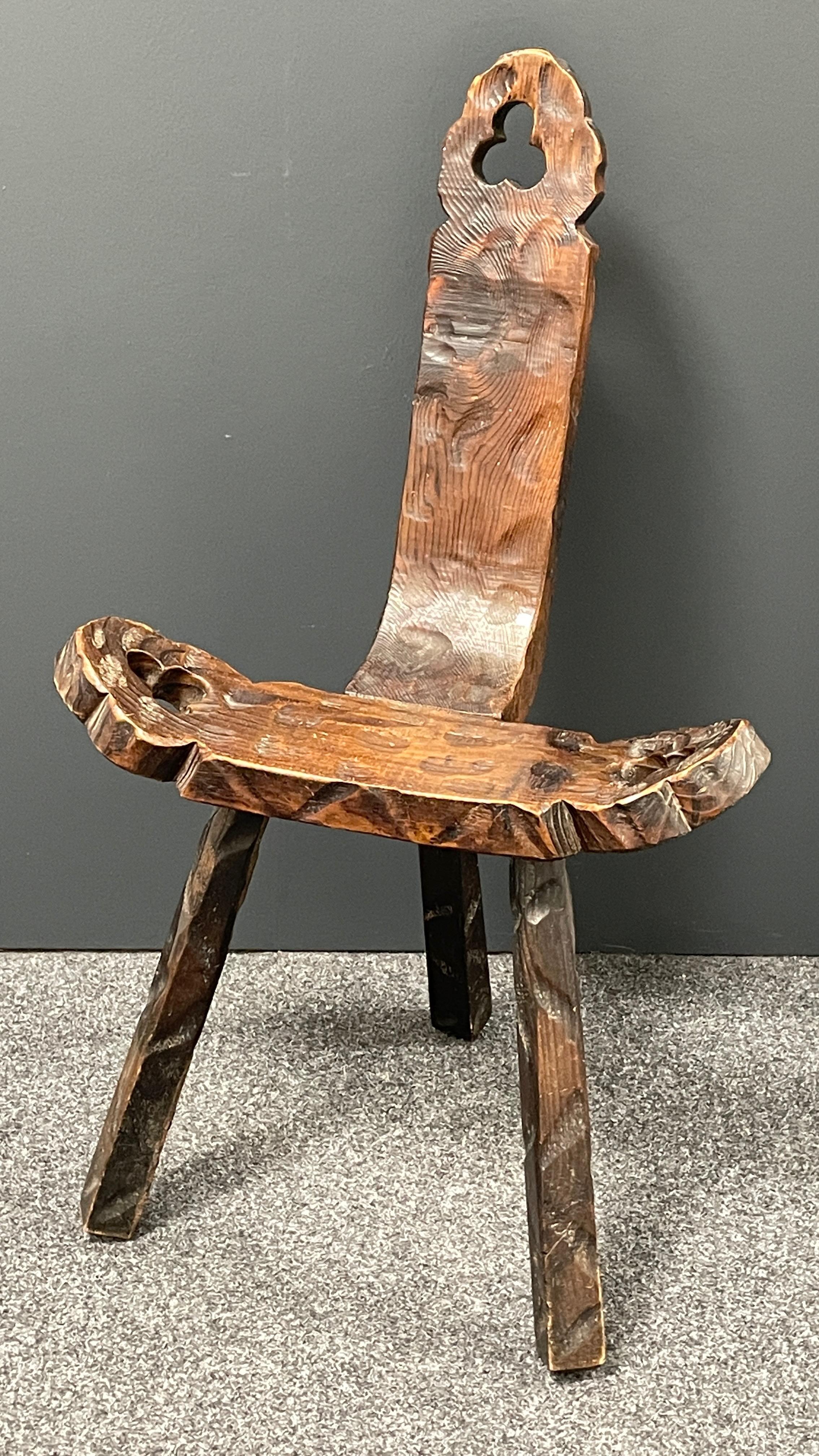 Interesting brutalist wood tripod chair from Spain. Notched holes in head rest and both arms. Historically used as a birthing chair. Great piece of functional sculpture. Good condition to wood. One leg a little wobbly which doesn't affect stability.