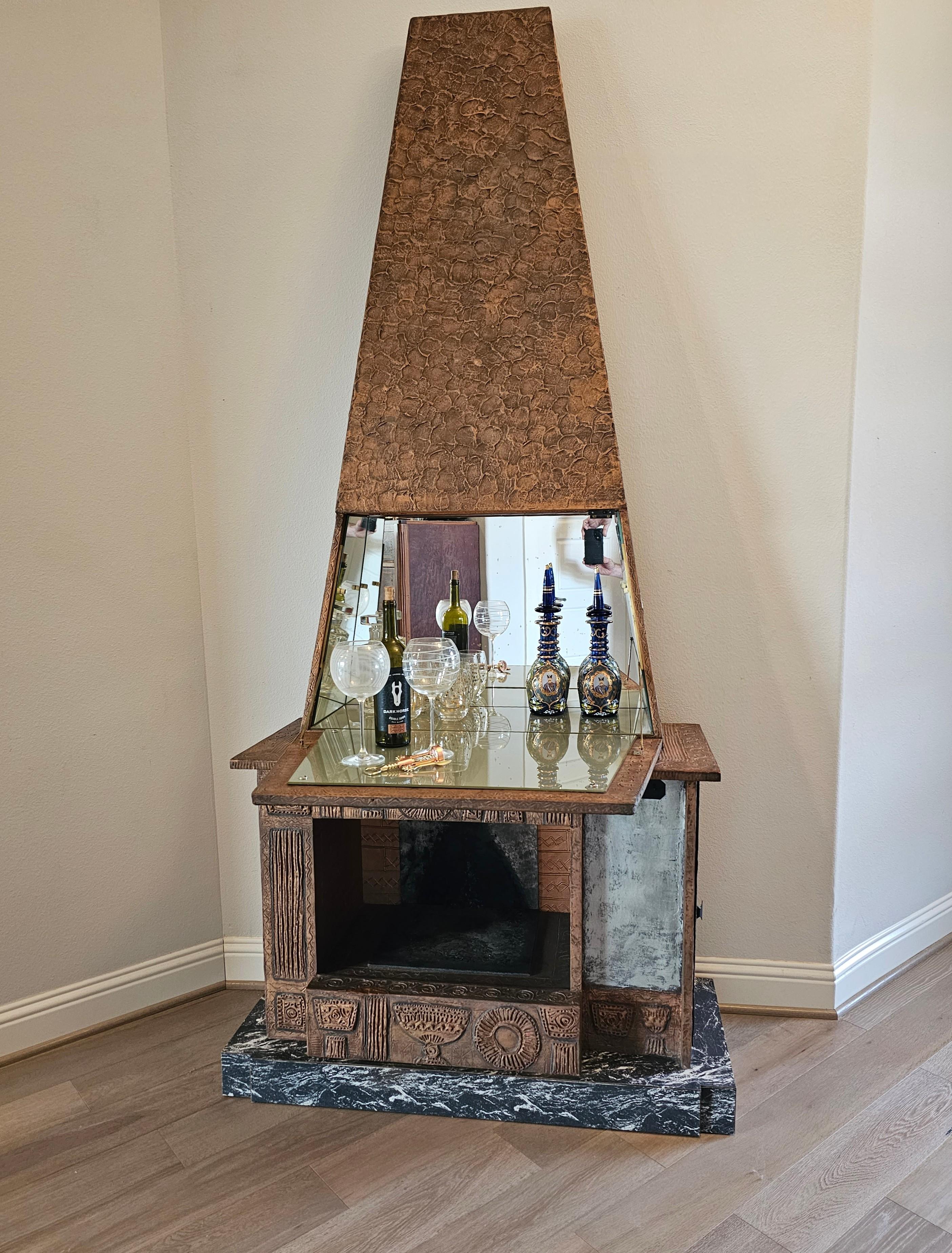 A magnificent Mid-Century Modern Brutalist style sculptural faux fireplace bar cabinet.

Sure to become the focal point of any room, most impressive size standing nearly eight feet tall, eye-catching architectural fireplace-form, stunning textured