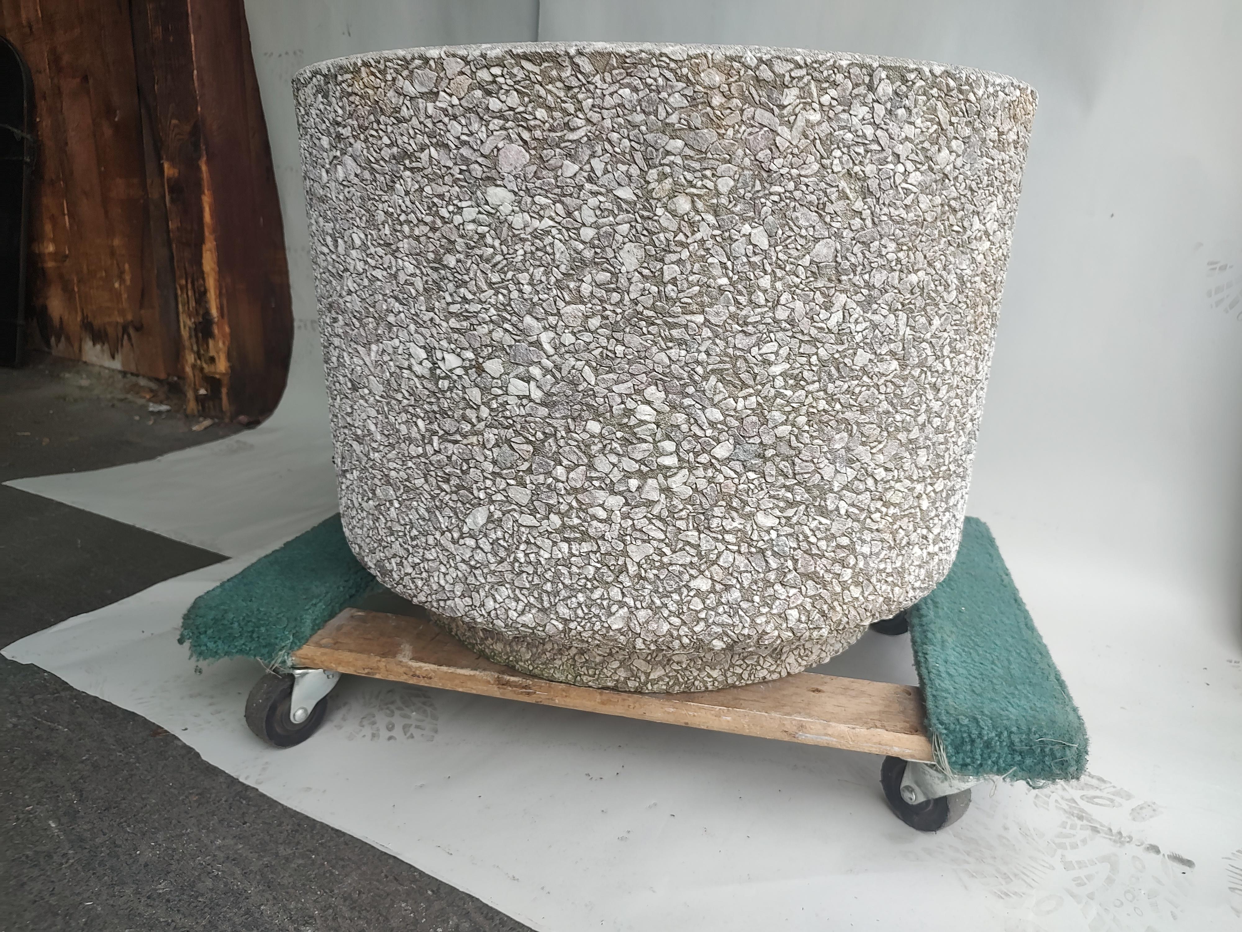 Fabulous Brutalist Style pebbled planters in a cast stone round form. Measures: 26 x 20h can hold whatever you would like, small trees to shrubs to plant and flower combinations. Drainage holes in all 3 planters.  In excellent vintage condition with