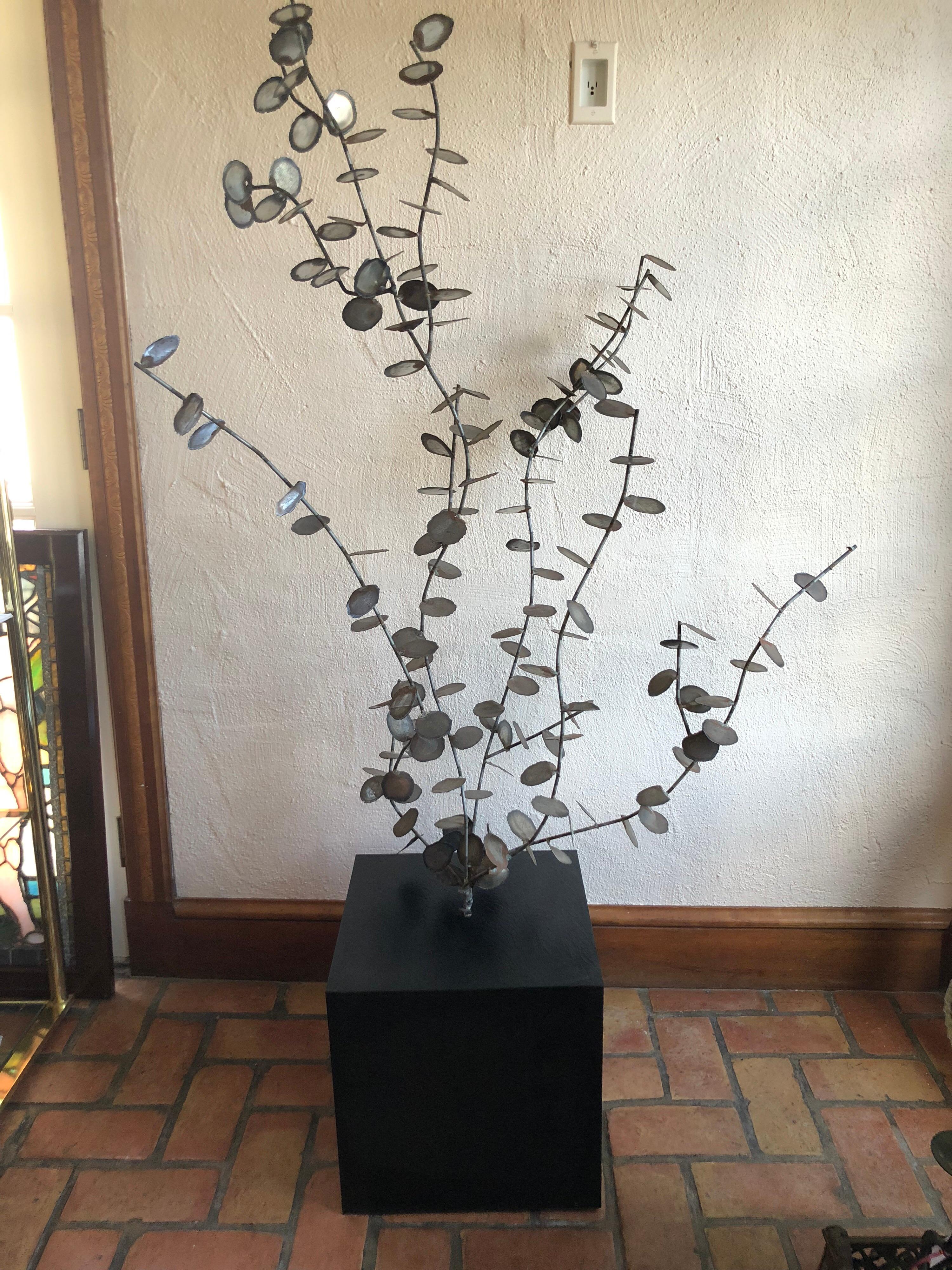 Mid-Century Modern Brutalist tree sculpture in the style of Curtis Jere but attributed to Silas Seandel. Fabulous eucalyptus shaped branches with circular torch cut Jere style teardrop leaves. Welded and attached to a laminated faux slate square