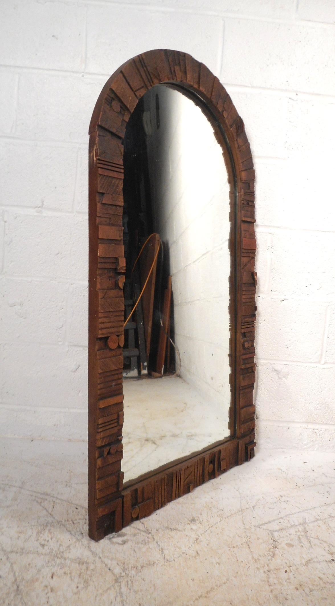 This beautiful vintage modern wall mirror features a carved Brutalist design with an arched shape top. A stylish and unique addition to any home, business, or office. In the style of Lane Furniture Co. Please confirm item location (NY or NJ).