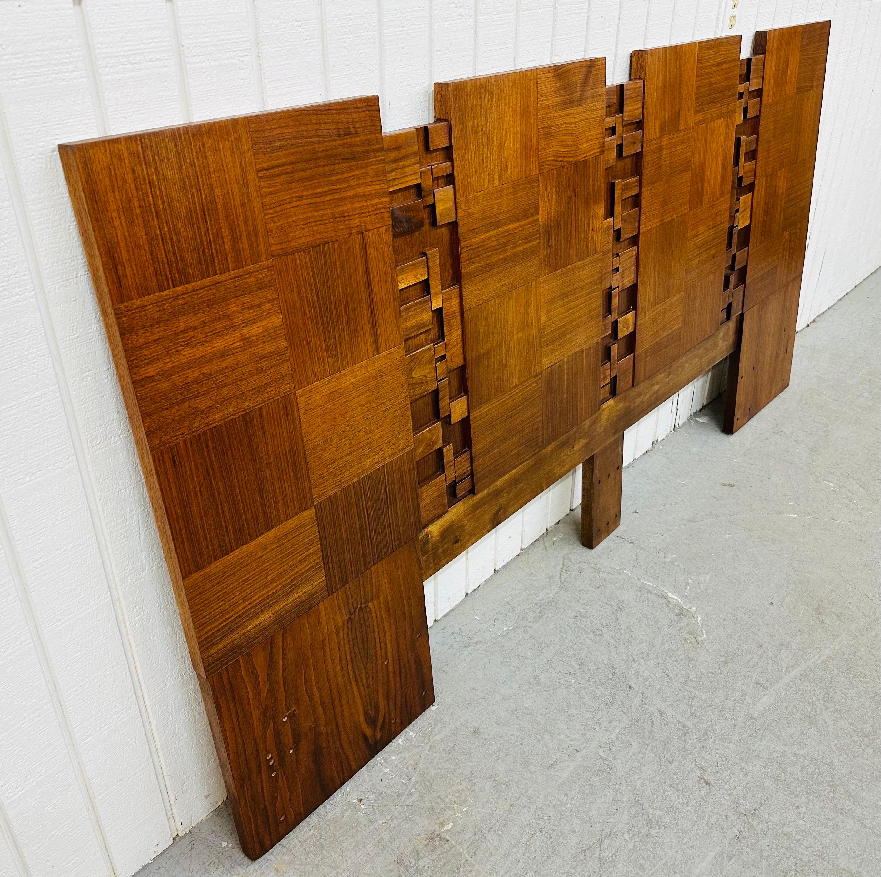 This listing is for a Mid-Century Modern Brutalist Walnut King Headboard. Featuring a straight line design, brutalist block front, and a beautiful walnut finish. This is an exceptional combination of quality and design in the style of Paul Evans!