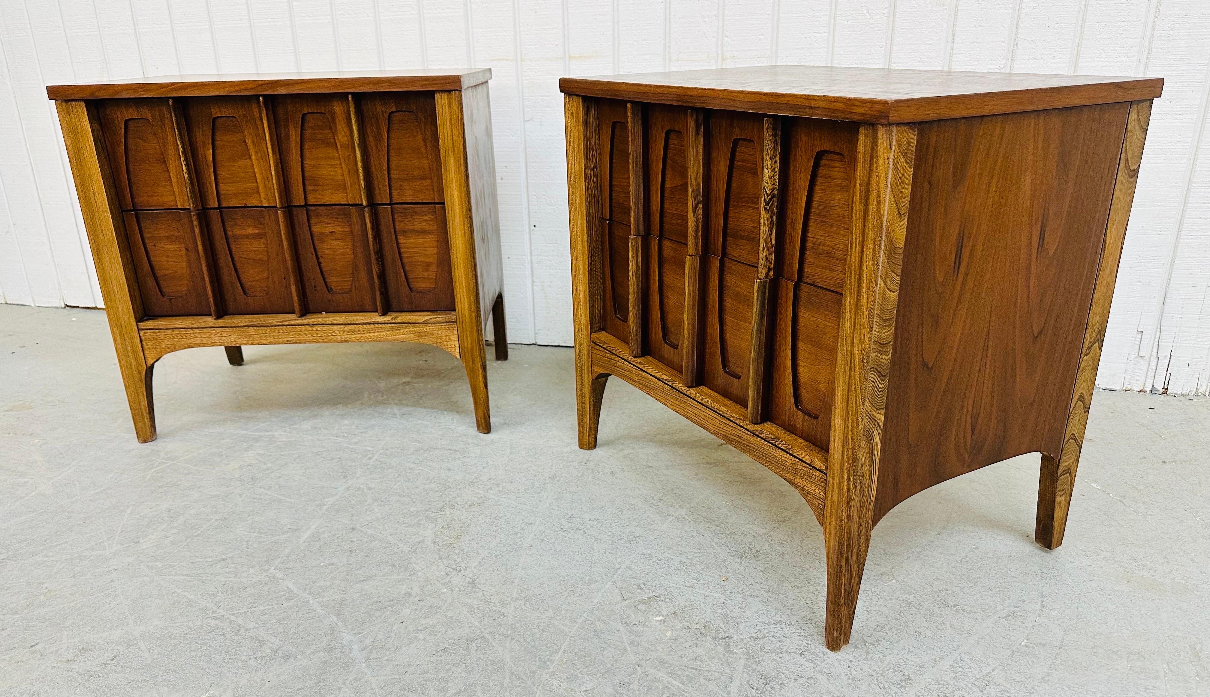 This listing is for a pair of Mid-Century Modern Walnut Nightstands. Featuring two drawers with brutalist designed fronts, rectangular tops, and a beautiful walnut finish. This is an exceptional combination of quality and modern design.