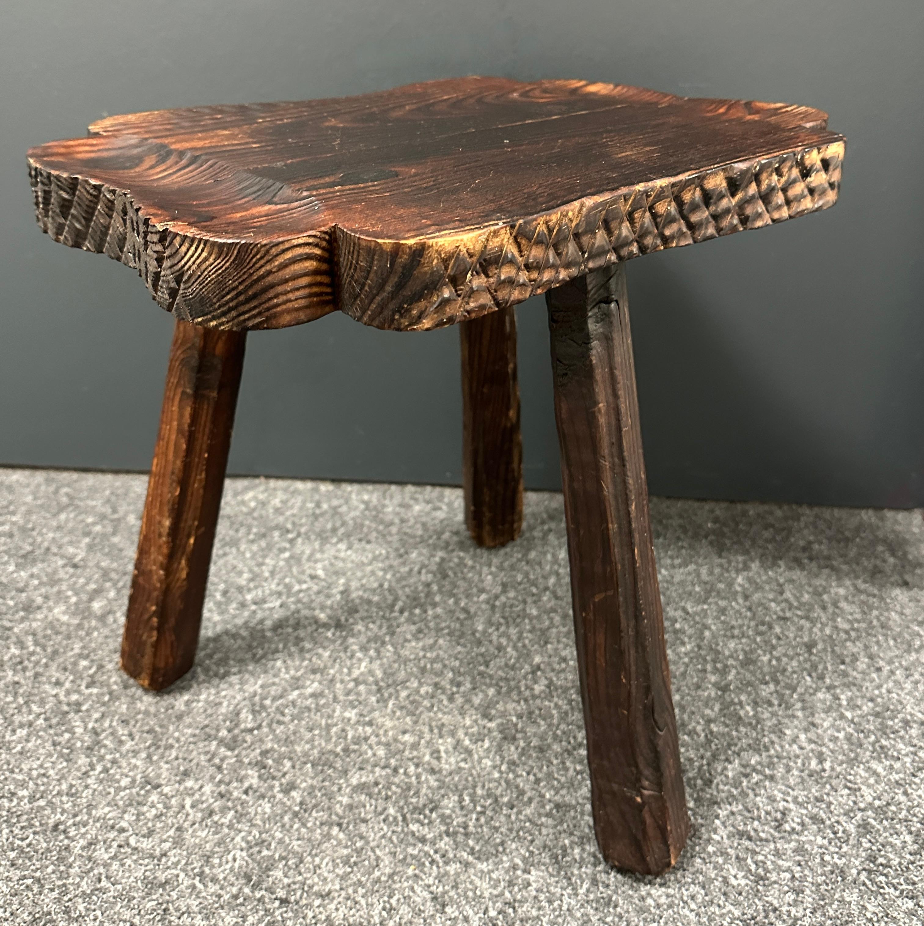 An interesting brutalist stool with hand carved legs and great patina. Great piece of functional sculpture. It is in great vintage condition and is structurally sound. Nice addition to your room, entry hall or patio.