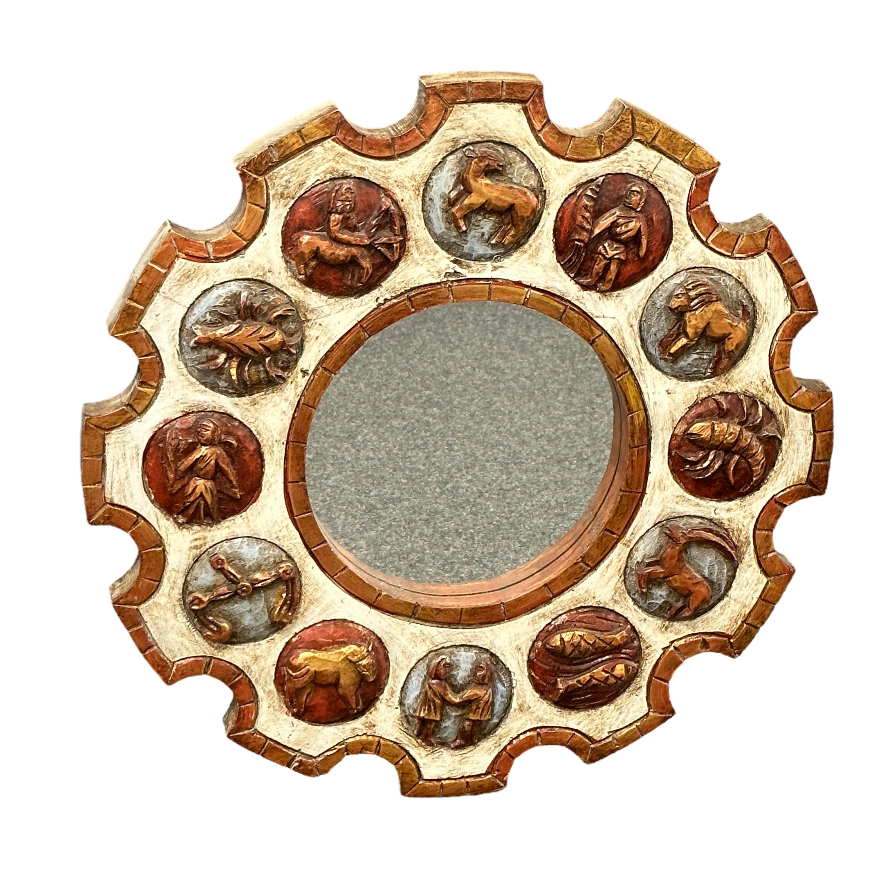 A beautiful Zodiac sunburst mirror in Carved Wood, Germany, 1970s. Brutalist Style Horoscope mirror with colored wheel frame and 12 signs of zodiac. Terrific zodiac signs on a brown cream white frame. Eye-catching contrast of the cream white frame