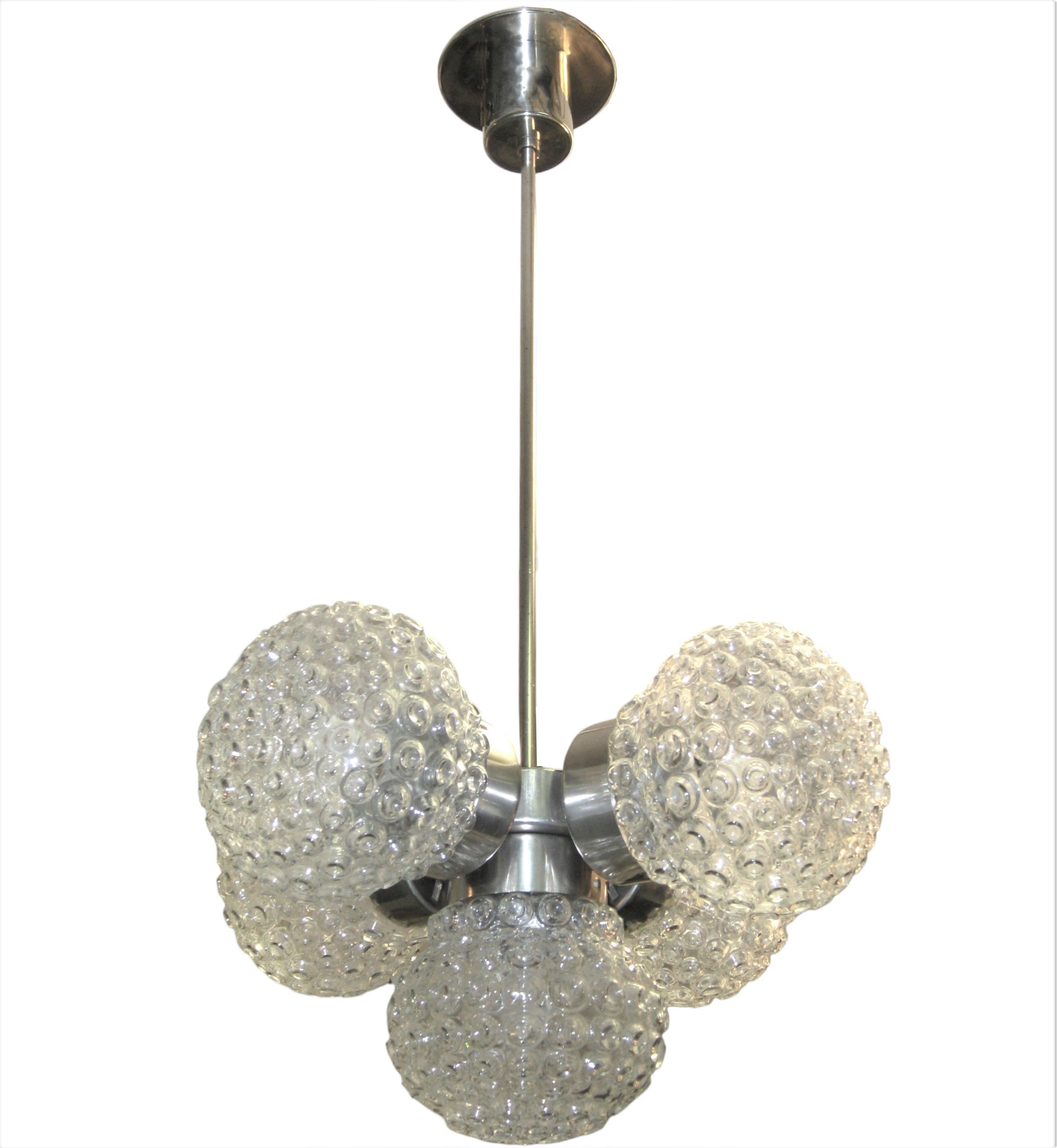 Mid century Modernist Italian ball chandelier.
 Five glass spheres with overall globule pattern delicately suspend from a satin silvery toned nickeled bronze tubular stem and cylindrical canopy.
This pendant light exudes whimsy and charm, while also