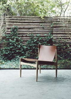 Mid-Century modern Buck Leather Lounge Chair by Erik Buck. New edition