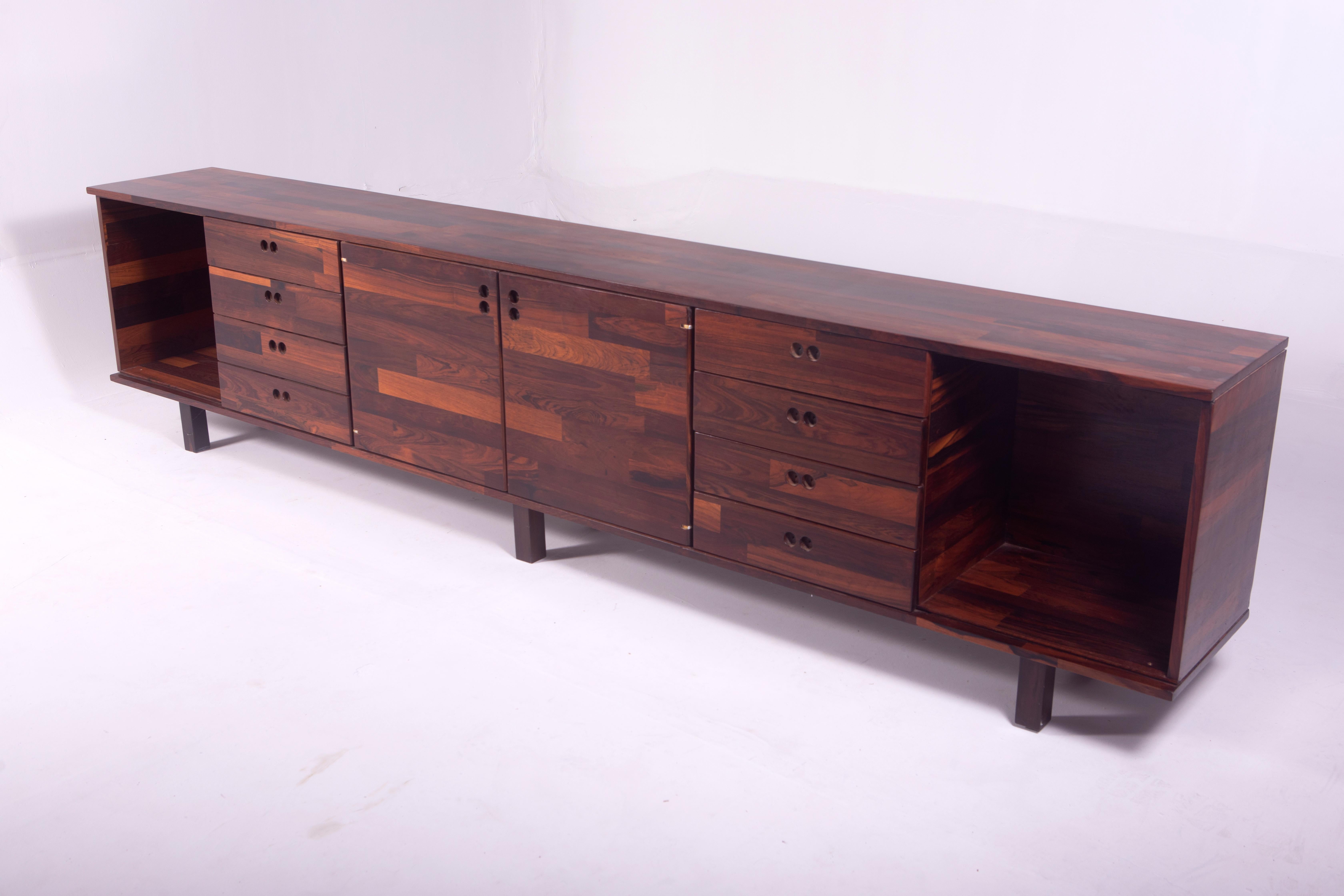 Mid-Century Modern Buffet by Jorge Zalszupin, Brazil, 1960s

Fashioned by the talented Polish-Brazilian architect and designer, Jorge Zalszupin, this solid wood buffet is a harmonious fusion of artistry and functionality. Boasting six storage