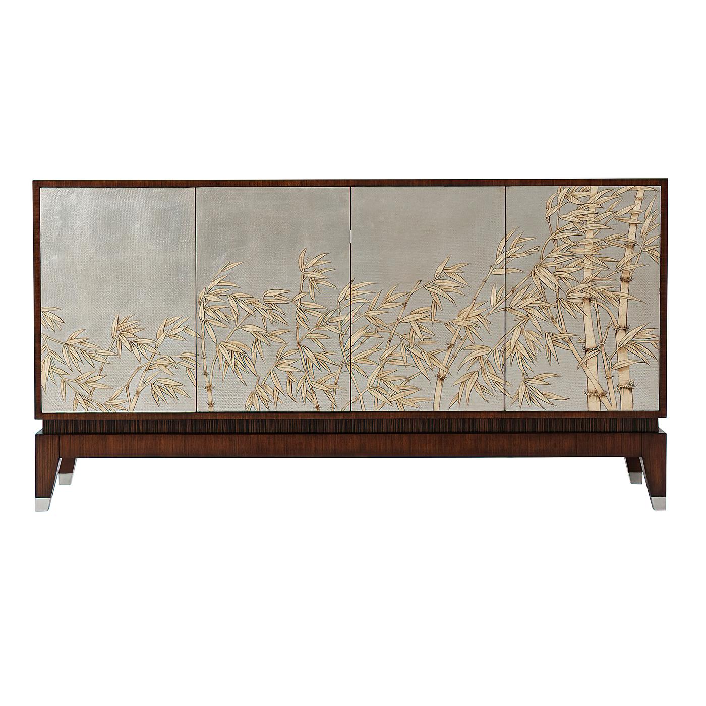 A Mid Century Modern style Hyedua veneered buffet, the rectangular top above four silver Argento doors with relief bamboo decoration, the interior in Sycamore with two adjustable shelves to the side cabinets, the center with four drawers and a