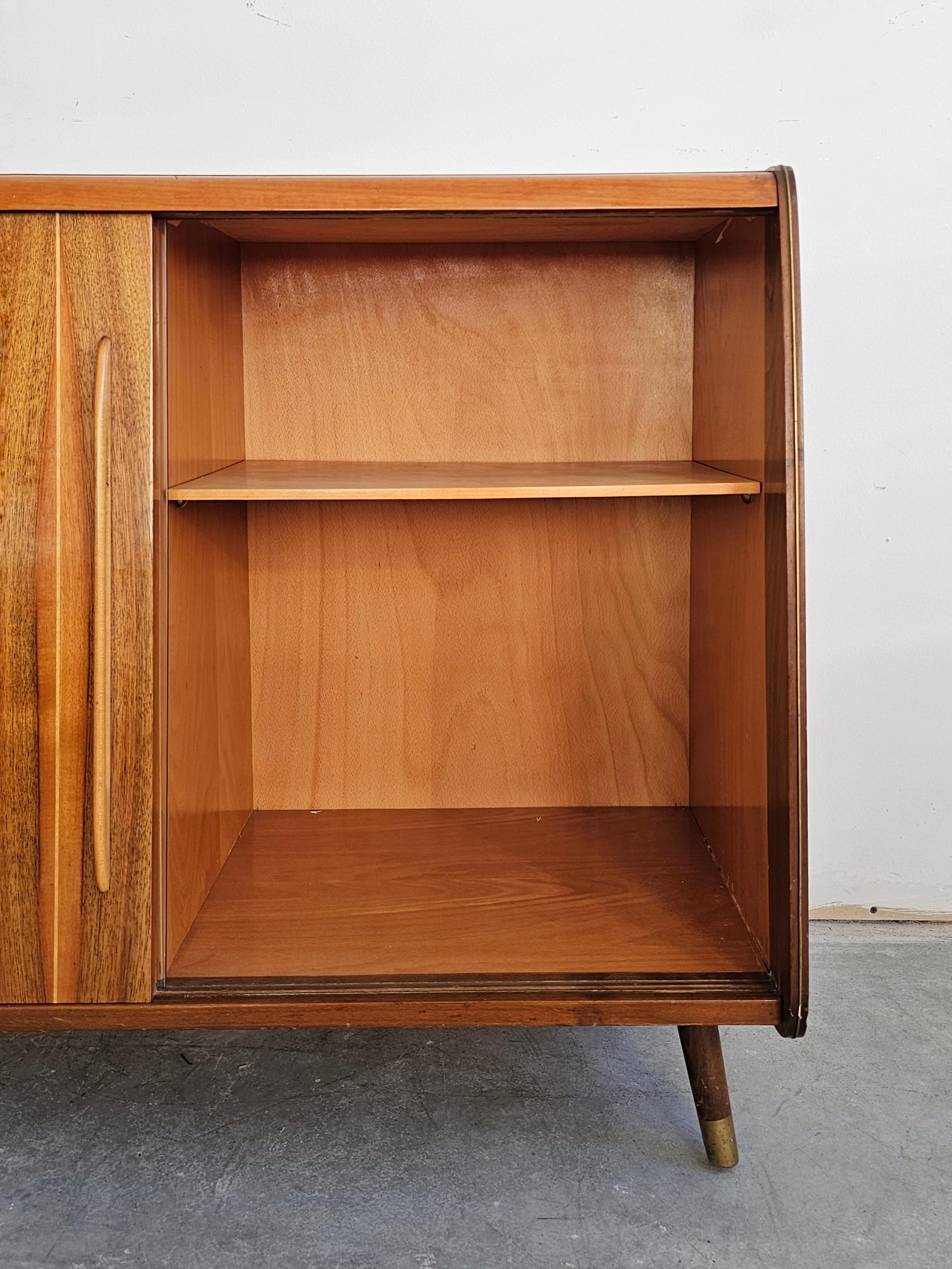 Brass Mid Century Modern Buffet or Vitrine done in walnut, with two compartments For Sale
