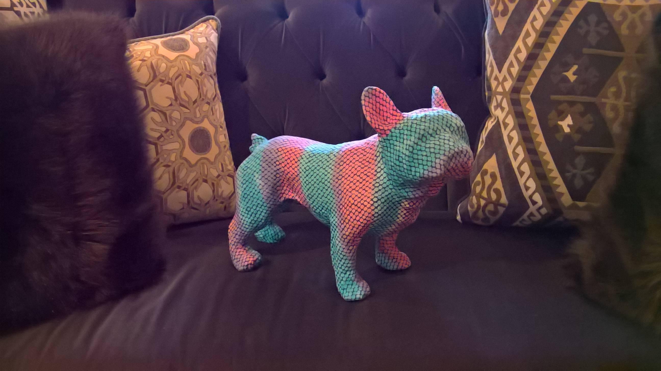 Naturalistic formed French bulldog sculpture. Made of acrylic resin completely covered with fabric in bright pink and blue colors.