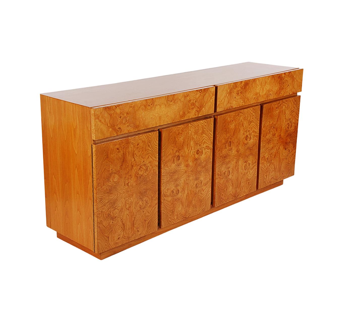 A beautiful 4-door credenza by Roland Carter for Lane Furniture. This piece features solid wood construction with bookmatched burl maple veneers.