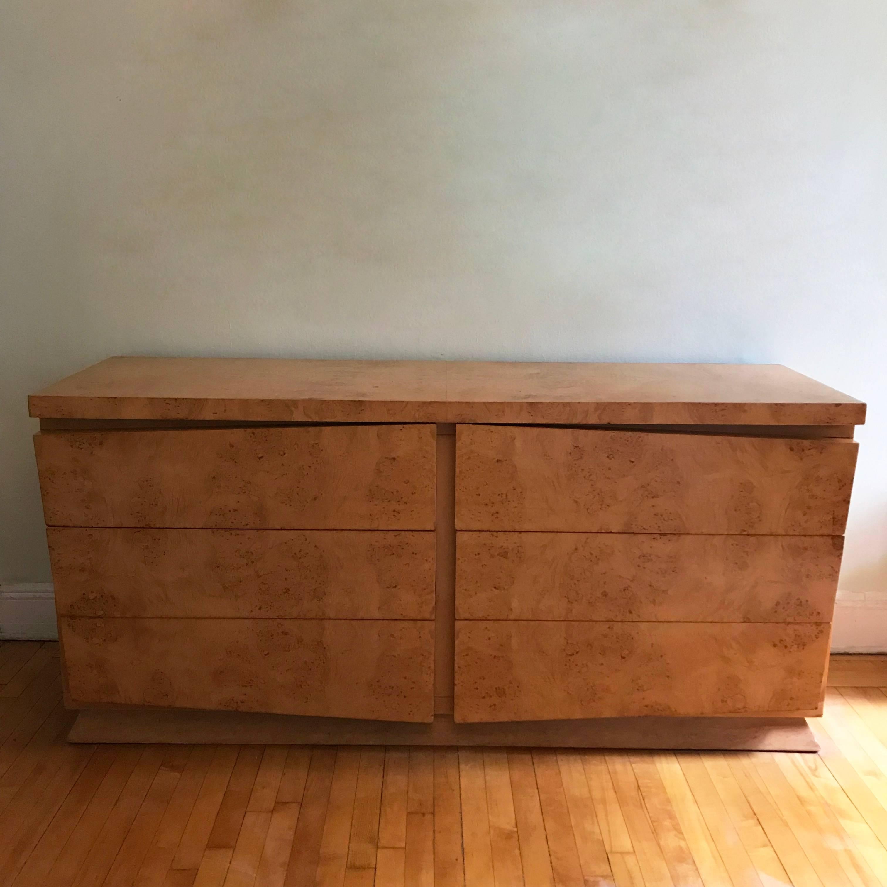 Outstanding, double-wide, Mid-Century Modern, dresser by Red Lion Furniture features architectural lines, with decoratively angled fronts on it's 6 large 7.5 inch height drawers with angled base. The designer is unknown but the accentuated lines