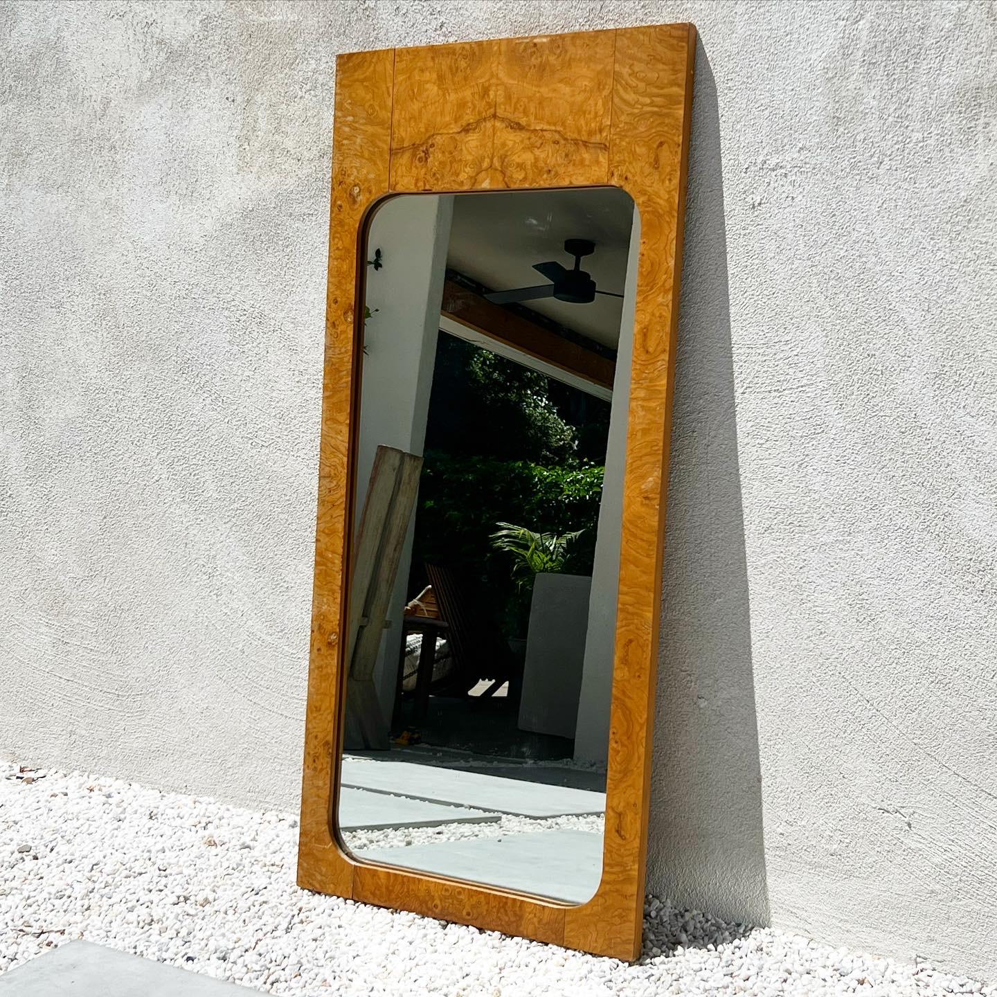 A Mid-Century Modern burl wood « Alpha » mirror by Lane, circa late 1960s or early 1970s. Minor signs of age, most significantly some separating of the wood which does not compromise the structural integrity of the piece, but overall fabulous