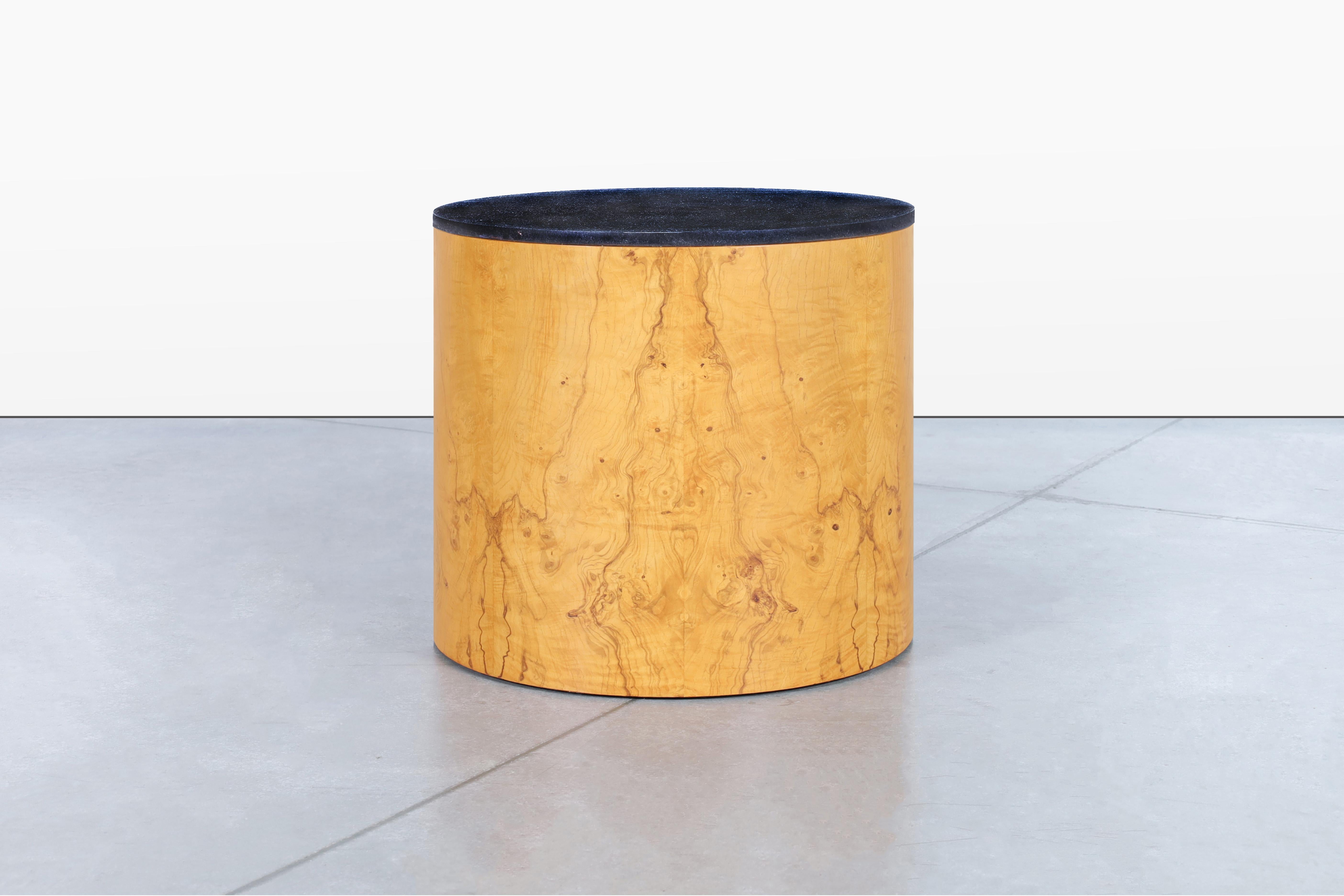 Fabulous mid-century modern burl wood and granite “drum” side table designed by Paul Mayen for Habitat International in USA, circa 1970s. This beautifully restored side table offers an exquisite combination of stunning olive burl wood and a