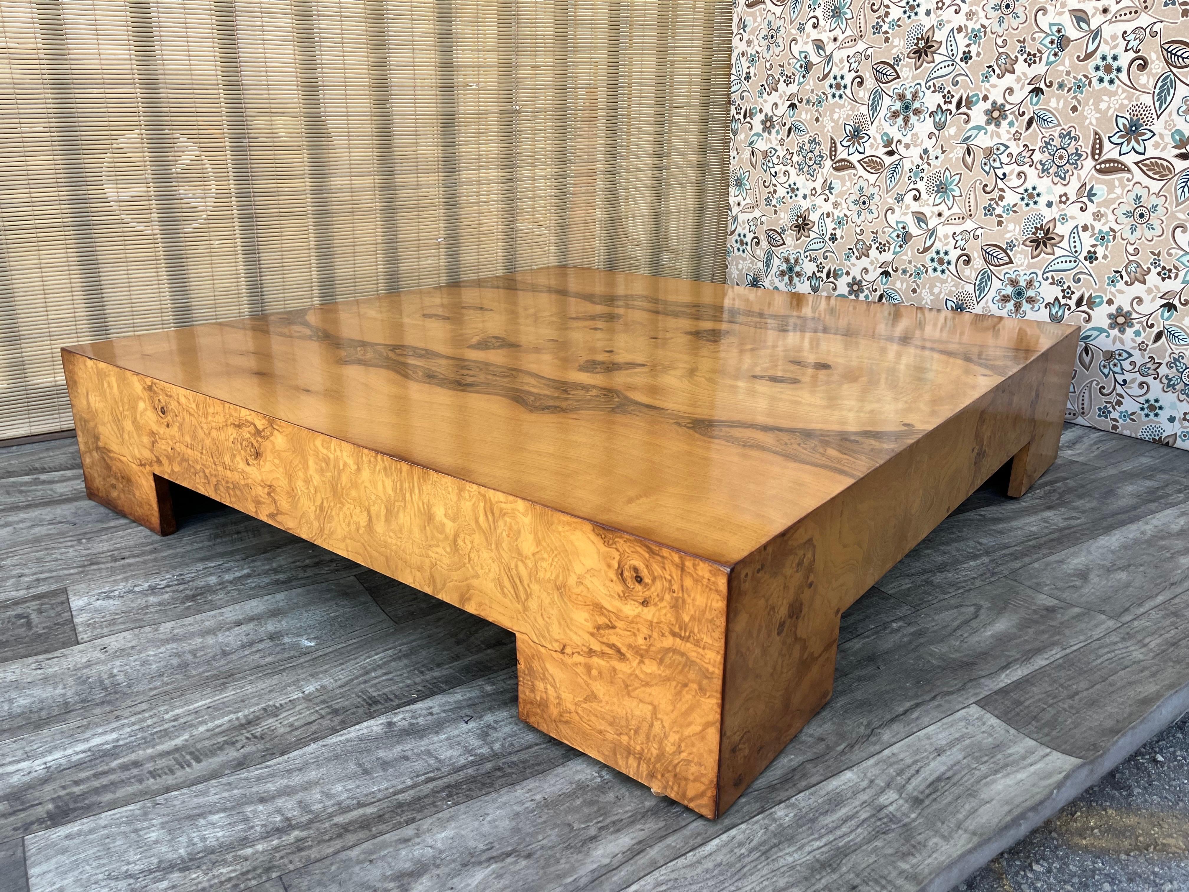 Vintage Fully Restored Mid Century Modern Burl Wood Coffee Table Attributed to Milo Baughman. Circa 1970s 
Features a monumental sizing, a Minimalist and Brutalist-inspired design, and a low 10