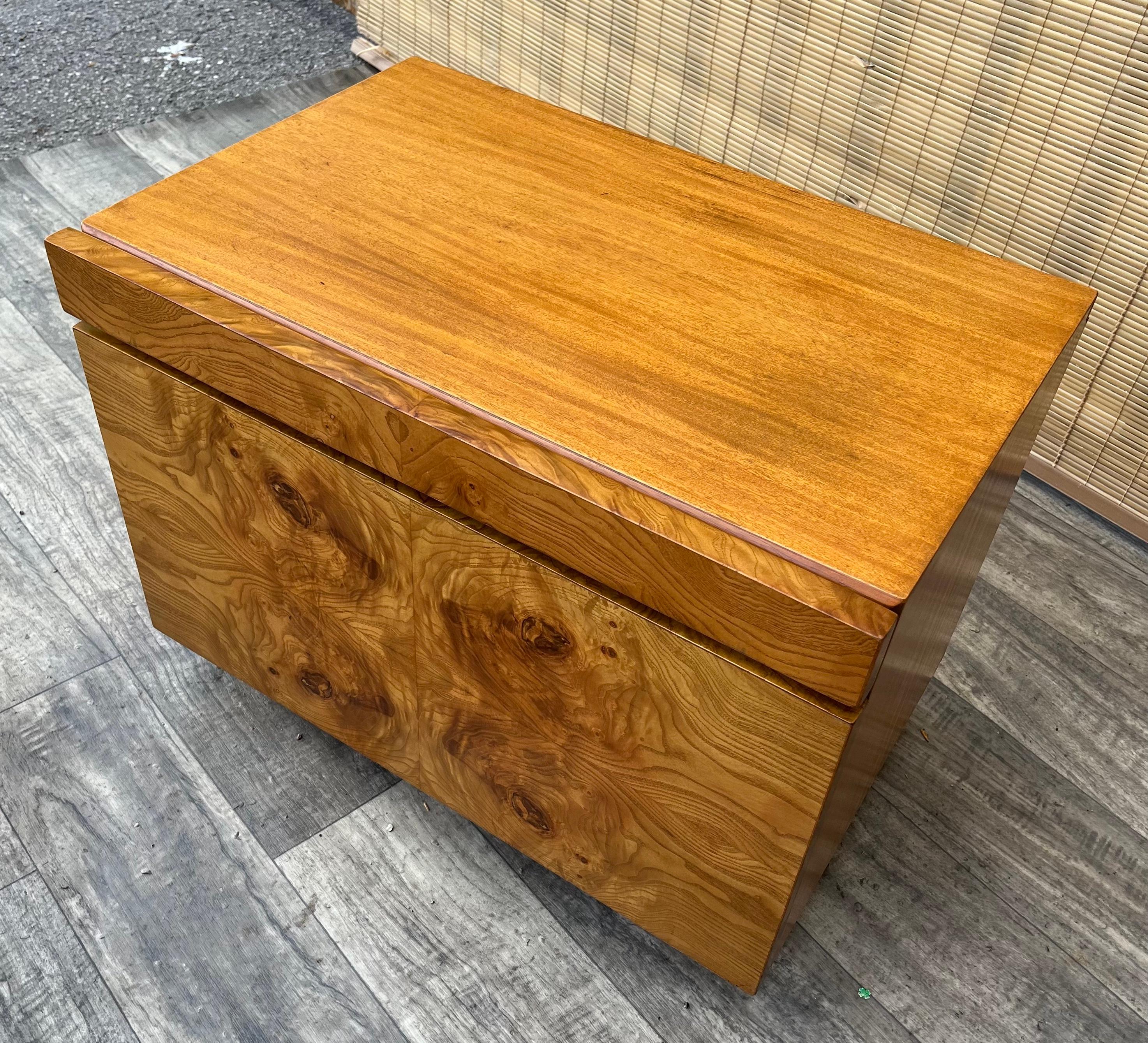 Vintage Mid-Century Modern Burl Wood Nightstand by Lane Altavista. Circa 1970s. 
Features a brutalist inspired design with beautiful olive burl wood veneer. With one large drawer and a laminated slide out shelve for extra surface. 
In a good