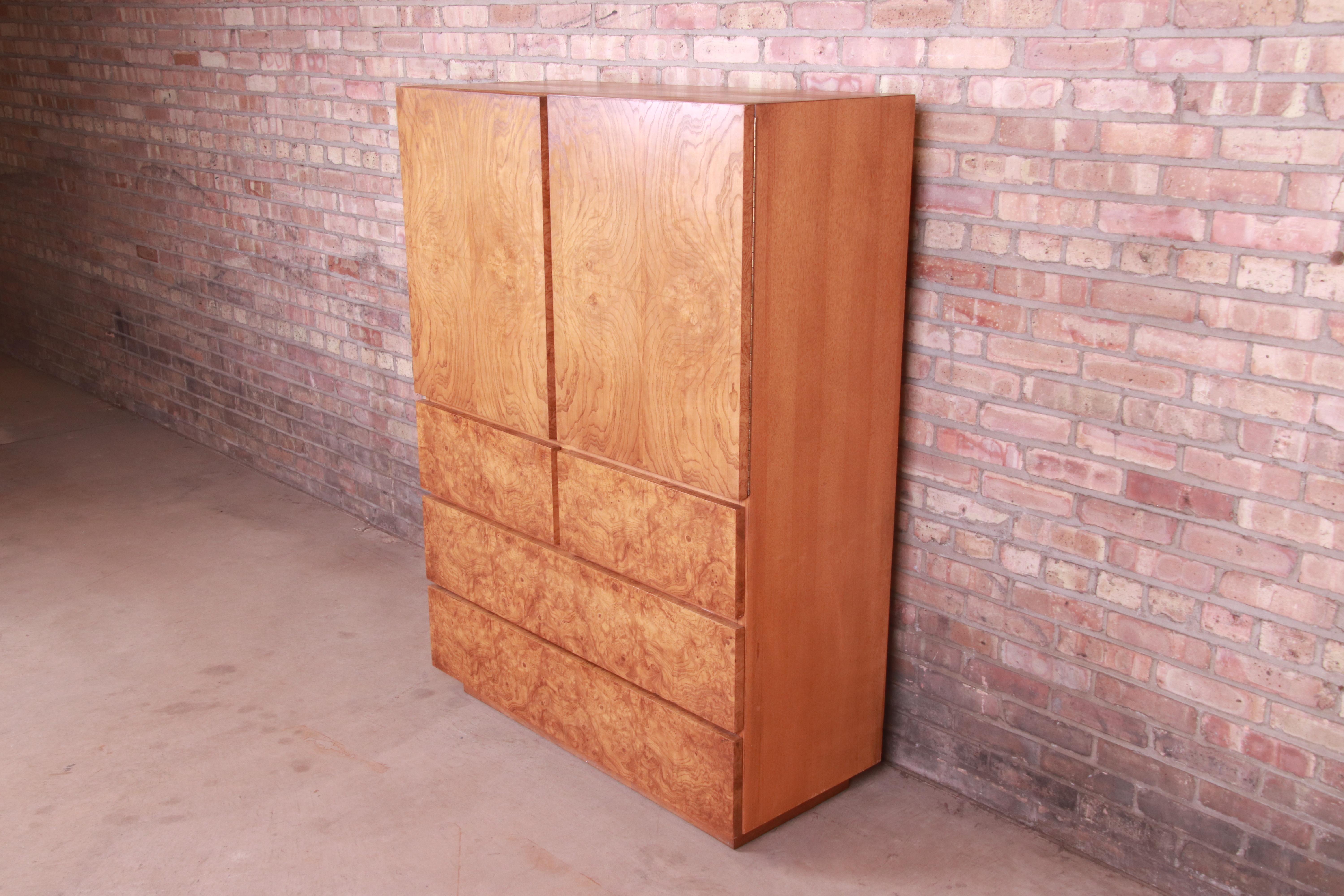 A gorgeous Milo Baughman style Mid-Century Modern highboy dresser or gentleman's chest

By Lane Furniture

USA, 1970s

Book-matched burled olive wood, with ash wood case.

Measures: 42.25