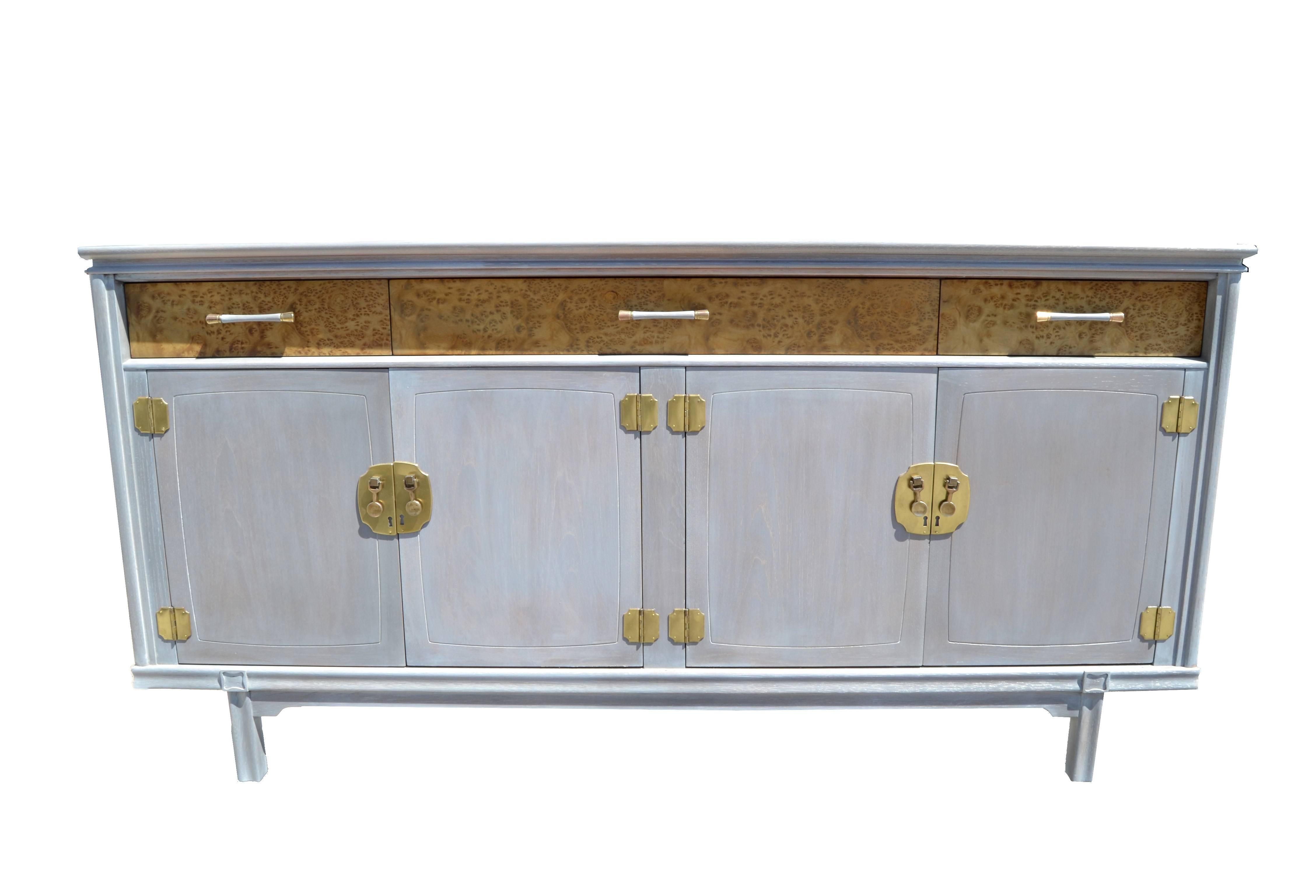 Mid-Century Modern Modernage Furniture Company burl wood and brass credenza in gray ceruse finish.
Features three drawers and two pull doors for lots of Storage Space.
Note the very detailed brass hardware, American Craftsmanship from the
