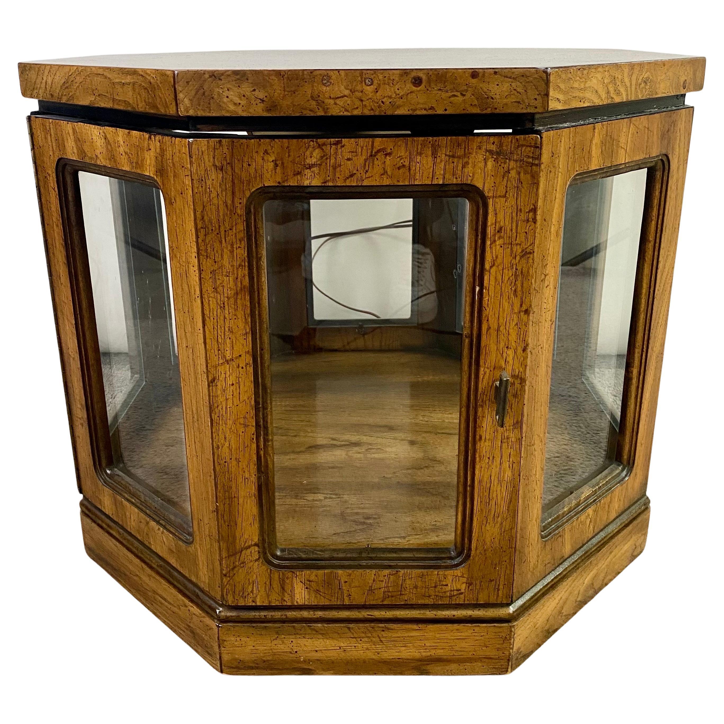 A mid-century modern pair of end or side tables in a hexagon shape. The quality tables are crafted of budwood and are sturdy. the MCM tables feature glass sides with one door opening and offering space for displaying items inside. Each are equipped