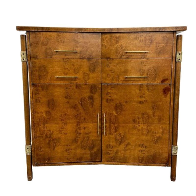 Mid-Century Modern burlwood hi-boy dresser / wardrobe cabinet, bronze accent.
Designed by Harold Schwartz for Romweber Furniture Company this one of a kind chest on chest has two drawers over two doors concealing six interior drawers having oak
