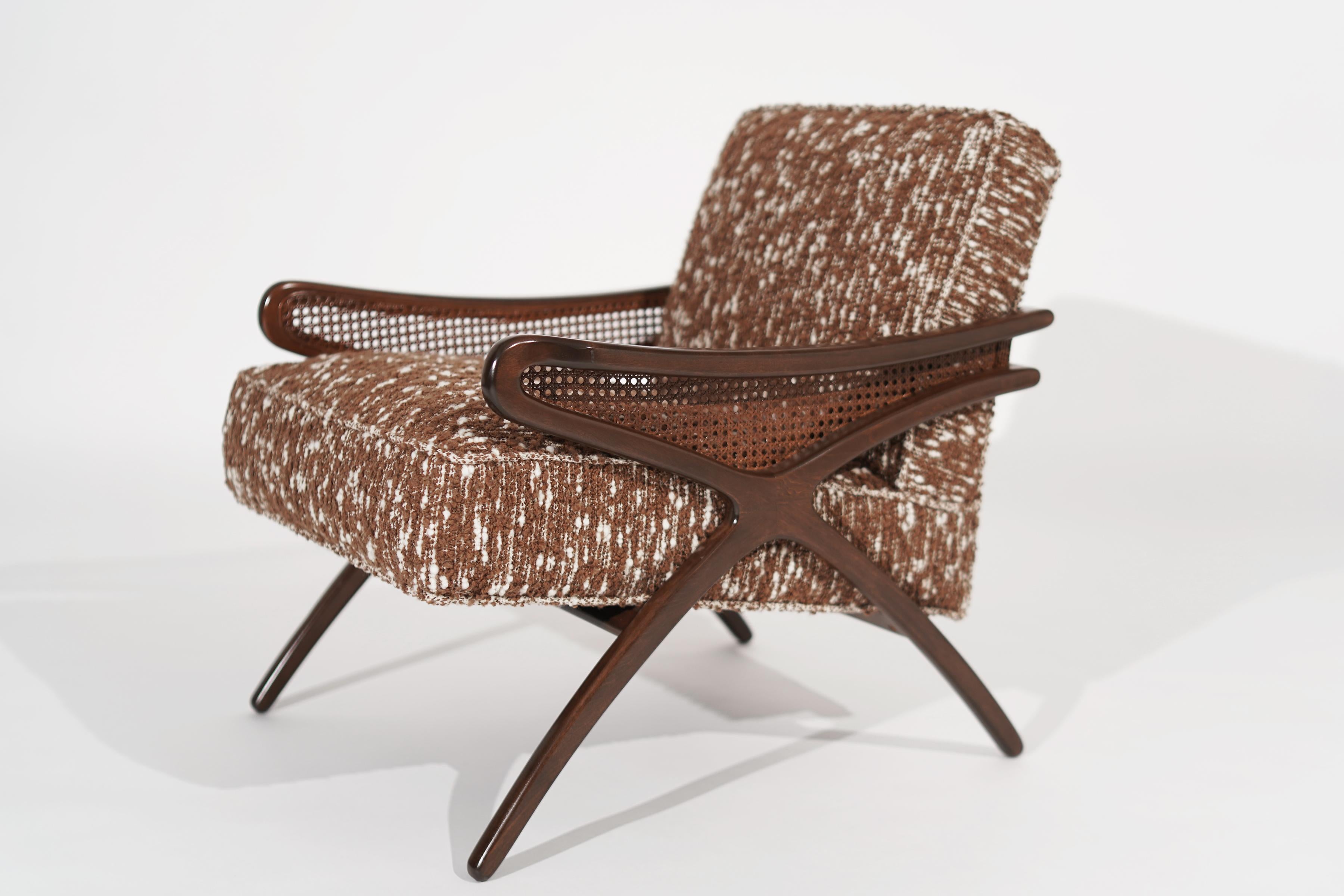 This lounge chair features a sculptural walnut framework with caning details. Reupholstered in a shaggy brown and beige wool. Very comfortable and perfect for a library or bedroom setting.

Other designers from this period include Paul McCobb,