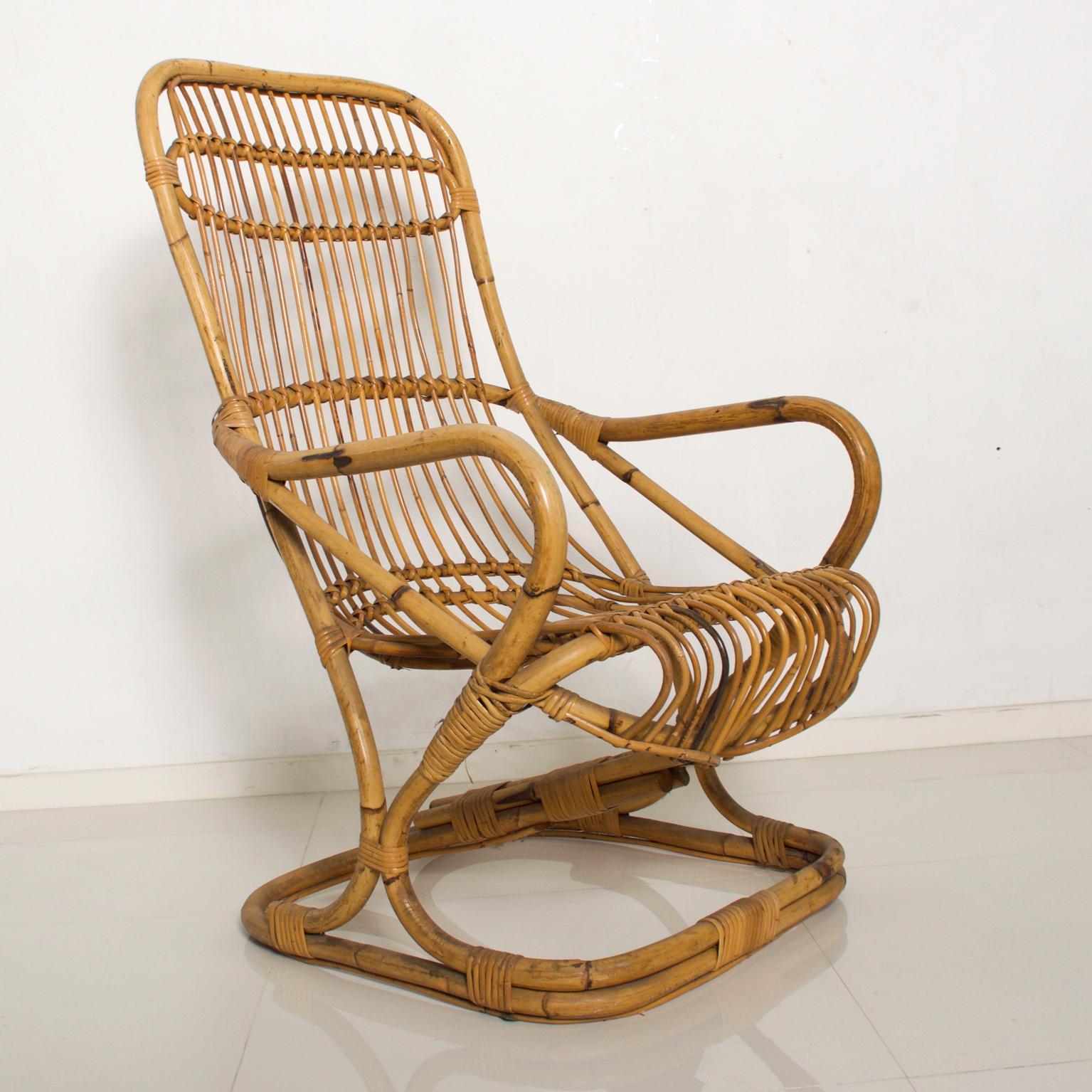 Italian Mid-Century Modern tall patio wicker and rattan comfy lounge chair from Italy. 
No attribution mark, circa 1950s
Dimensions are: 41 3/4
