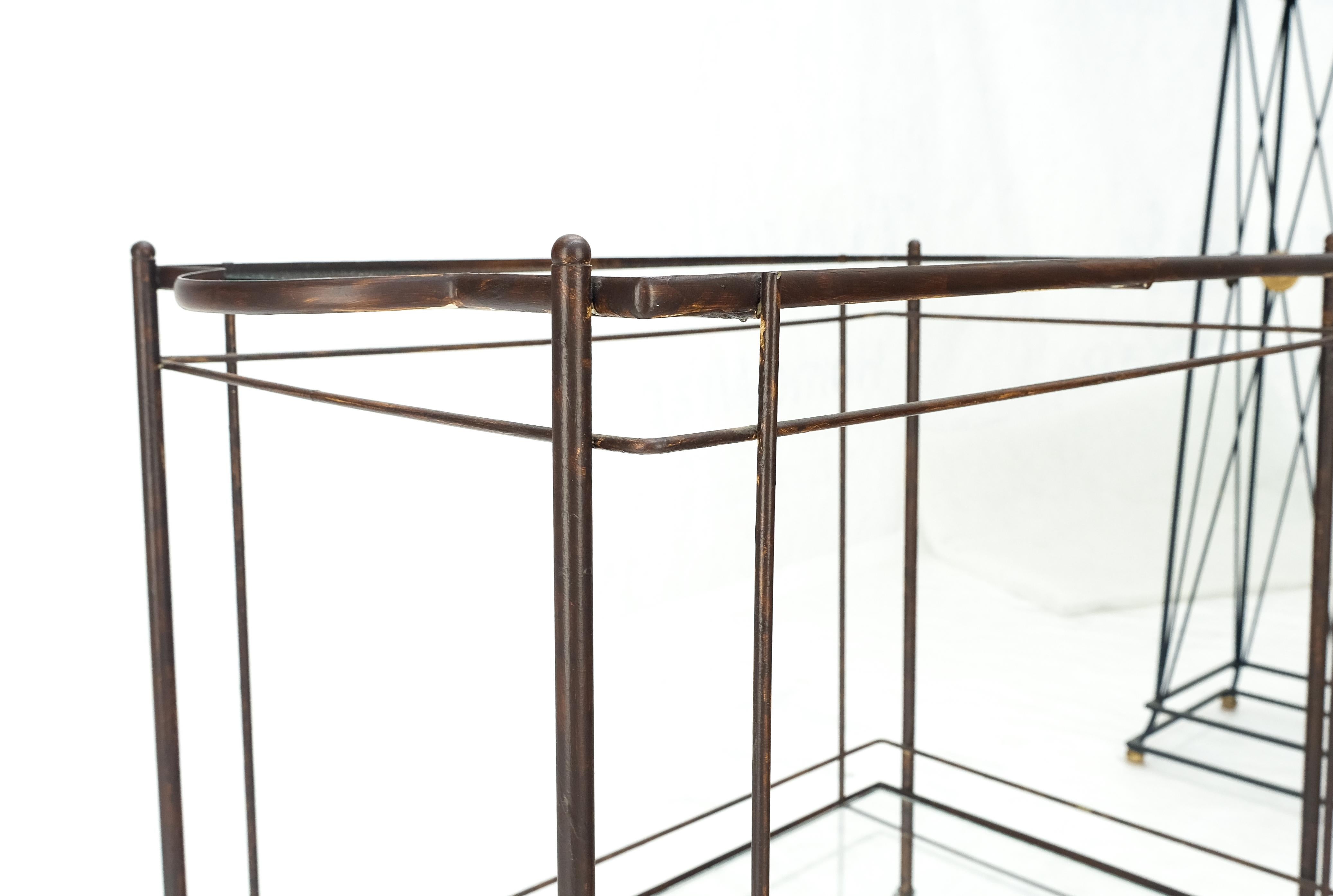 Mid Century Modern c1950s Rolling Brass Two Tier Rectangle Serving Cart Wheels.
Heavy bronze patina.
Normal due to age and use scratches in the glasses