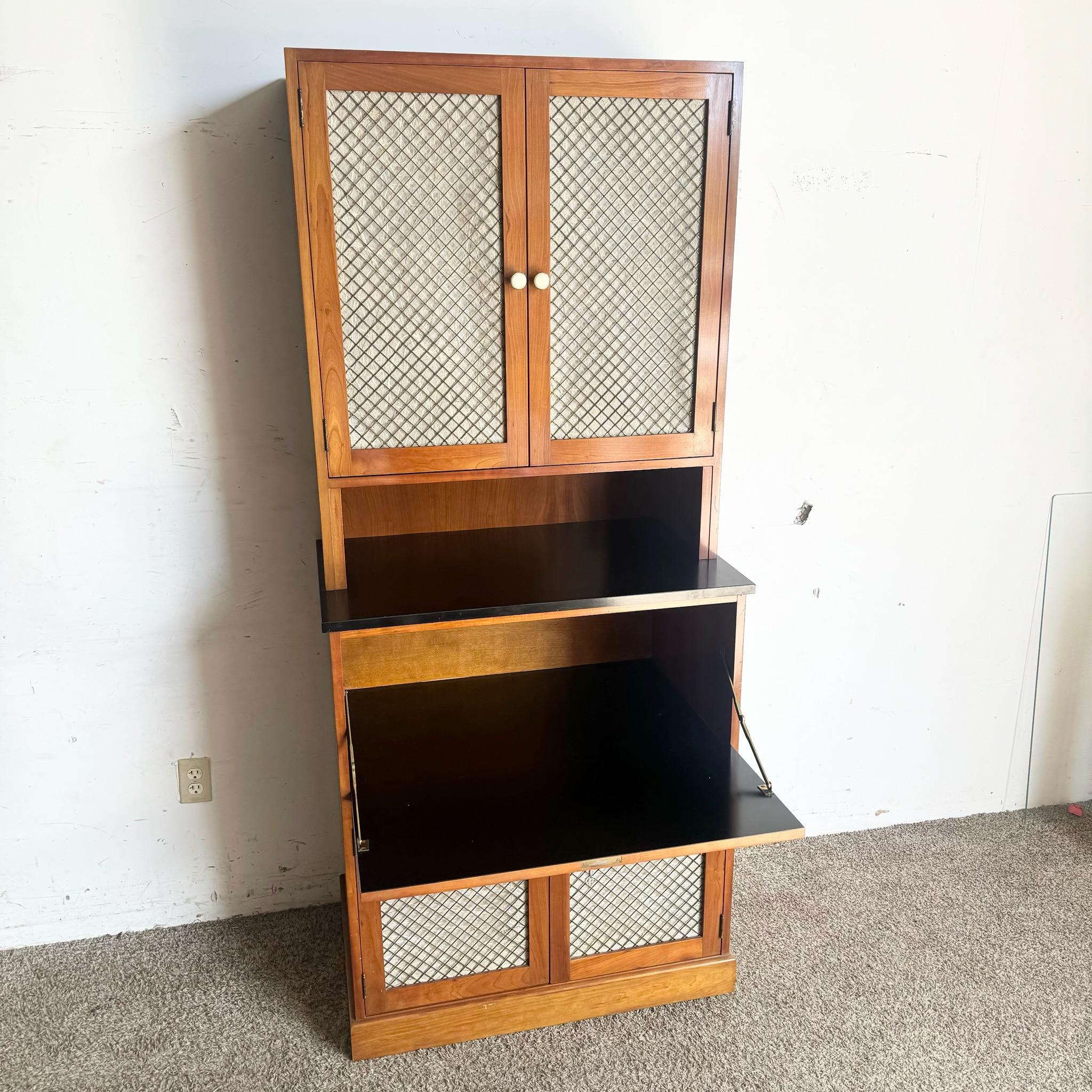 This Mid Century Modern Dry Bar Cabinet is perfect for entertaining, featuring a sleek design and ample storage for your favorite spirits. Its compact form and elegant finish make it an ideal addition to any living room or dining area.
